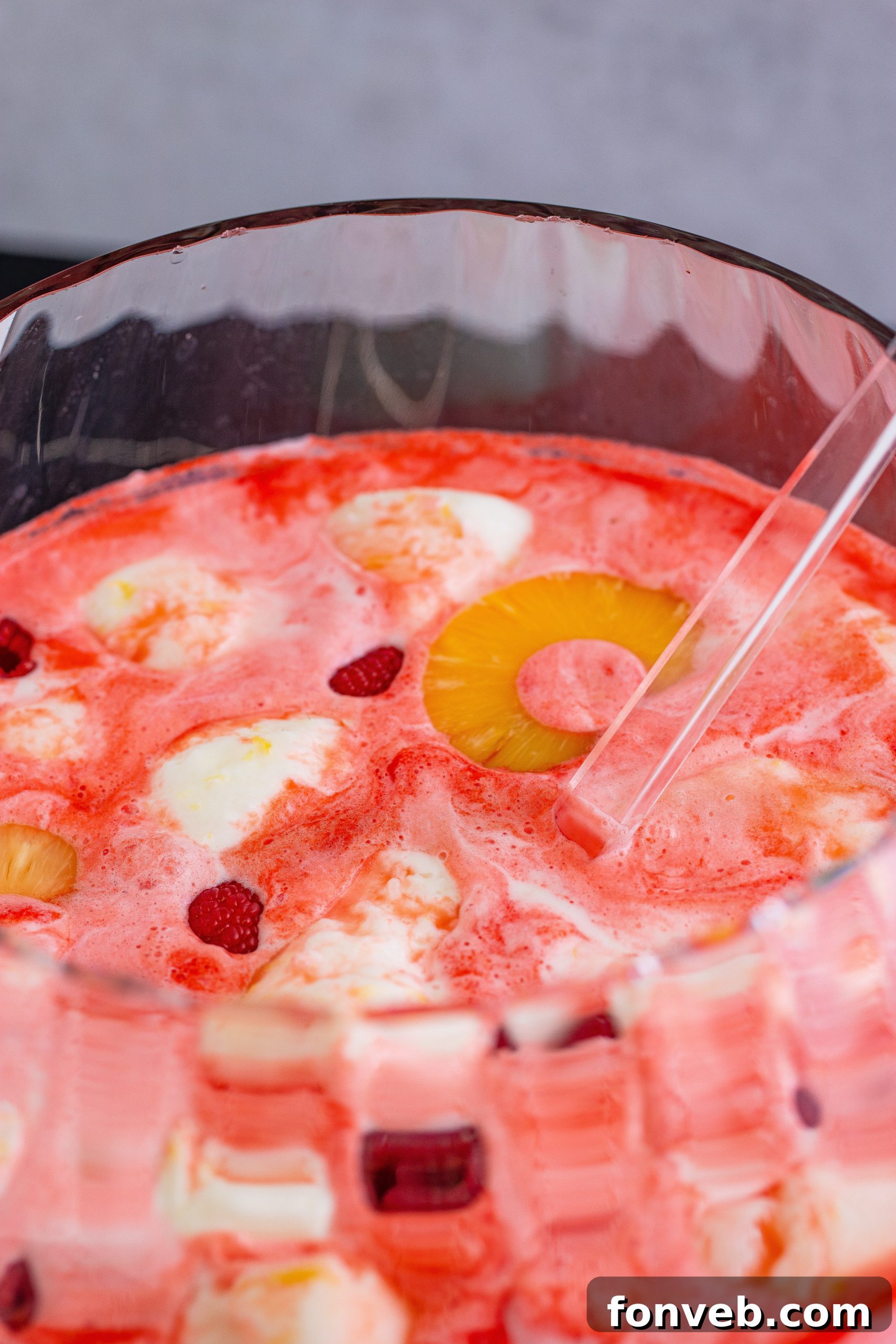 A festive punch bowl overflowing with Boozy Sherbet Punch, ready for a party.