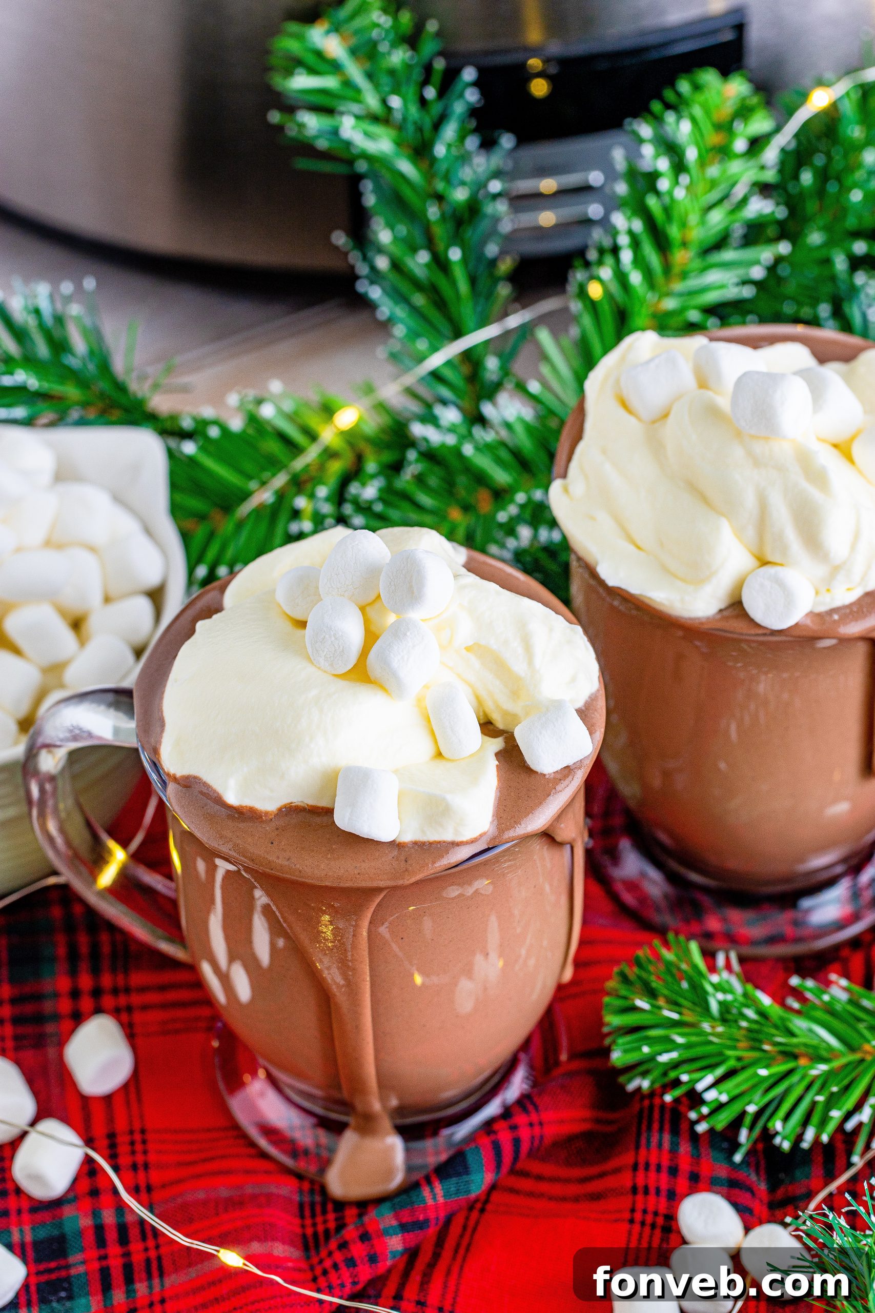 A selection of high-quality ingredients for slow cooker hot chocolate, including heavy cream, cocoa powder, and whole milk, arranged on a rustic wooden surface.