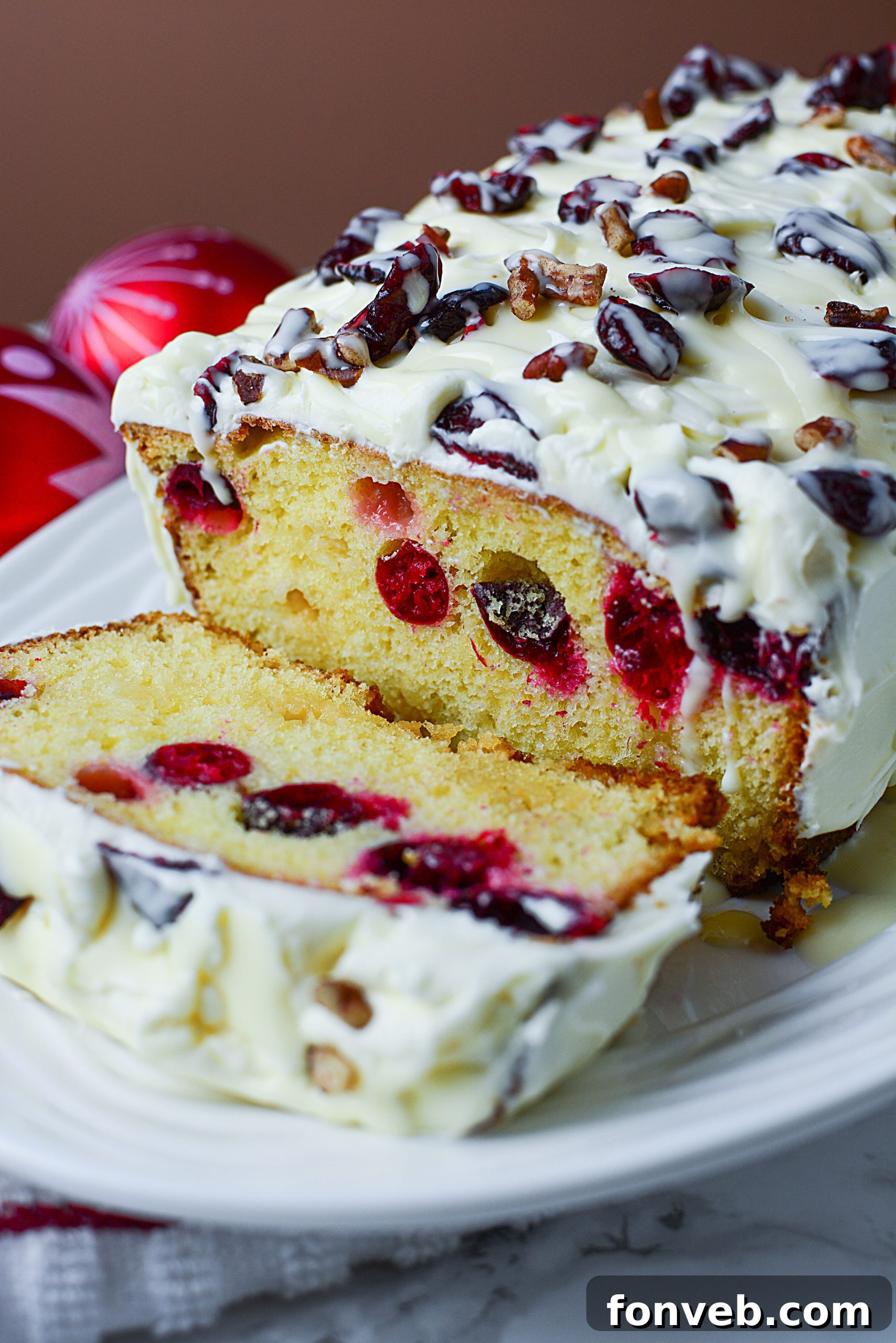 Crimson Cranberry Holiday Cake 3 Close-up of a festive Cranberry Pound Cake, showing its moist crumb and vibrant cranberries.