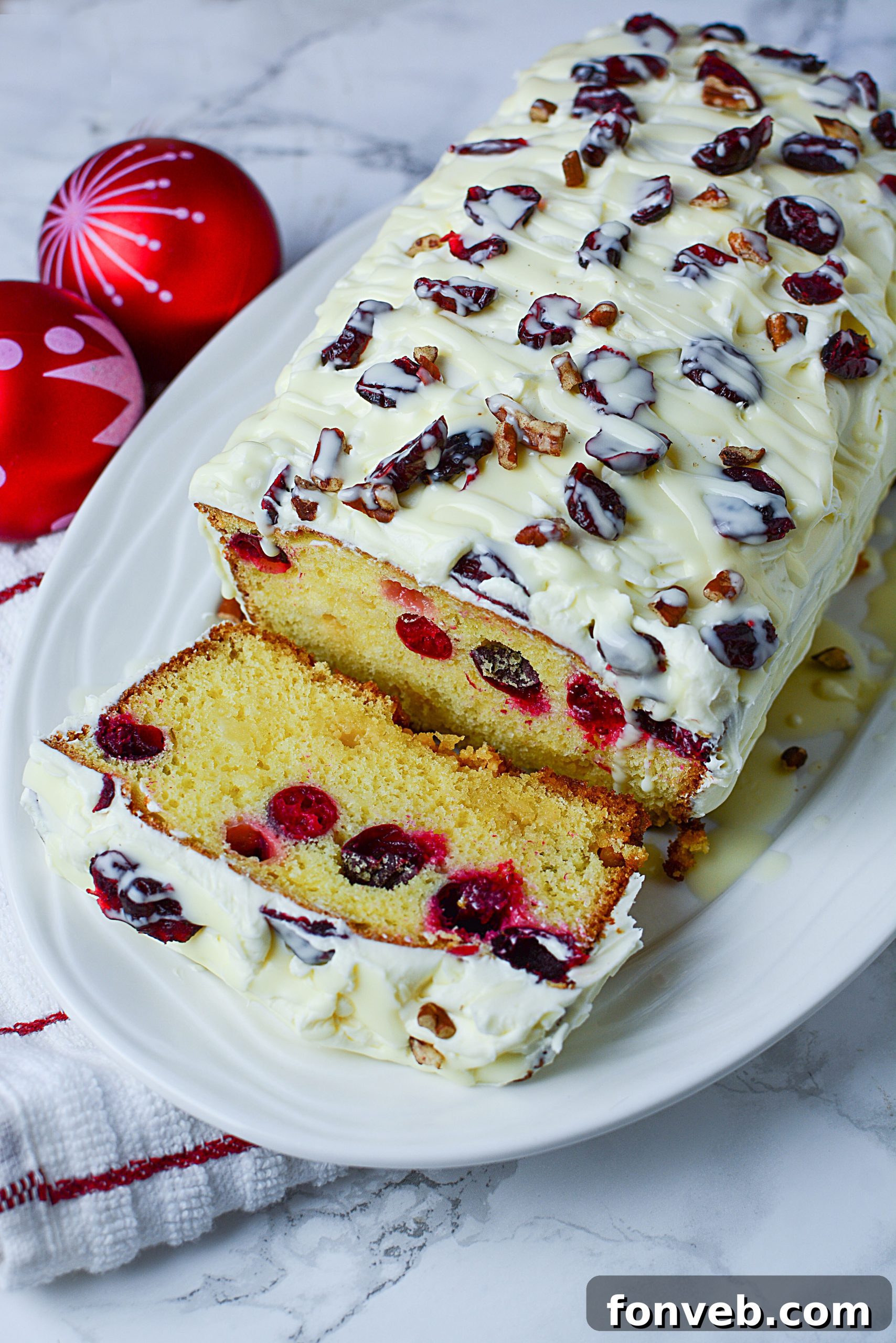 Crimson Cranberry Holiday Cake 4 Whole Christmas Cranberry Pound Cake on a rustic board, ready for holiday celebrations.