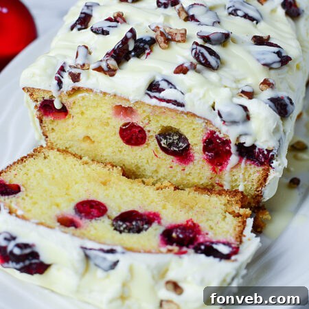 Delicious Christmas Cranberry Pound Cake with creamy frosting.