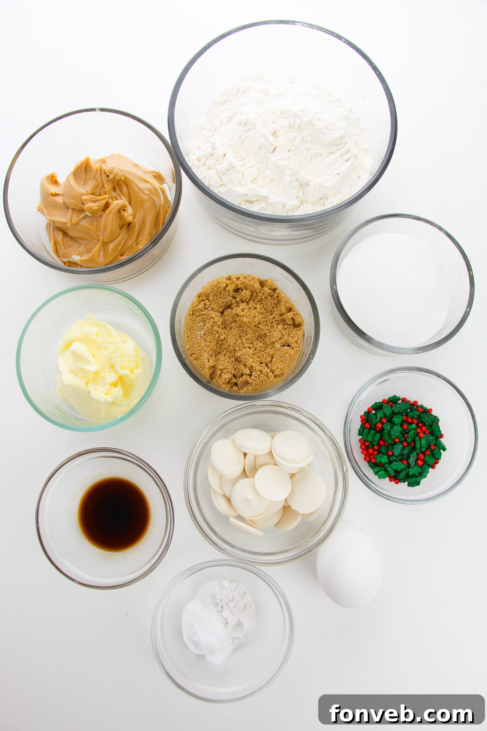 Close-up of a perfectly baked peanut butter cookie, half-dipped in white chocolate with colorful sprinkles