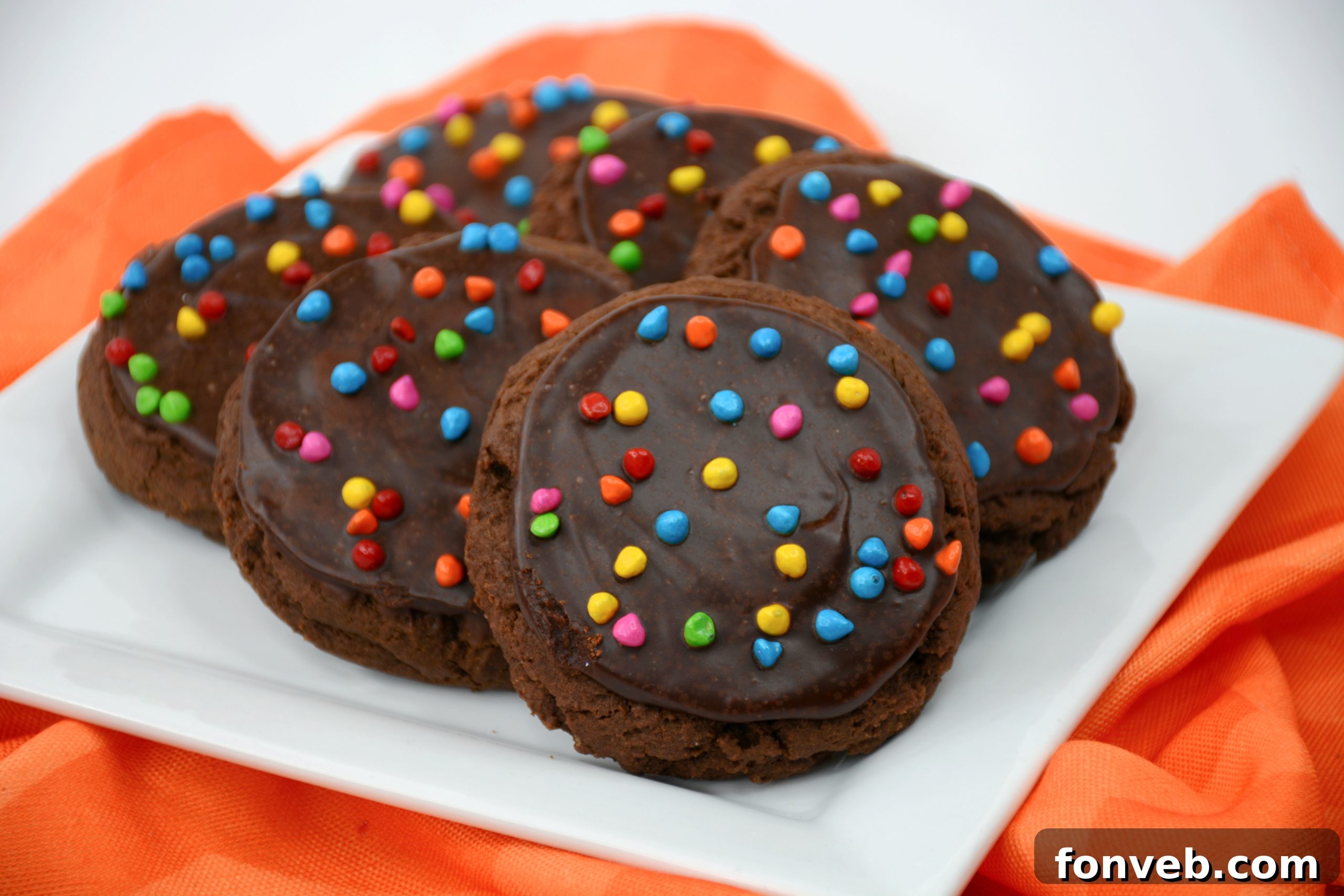 Close-up of freshly baked Cosmic Brownie Cookies with colorful candy sprinkles.