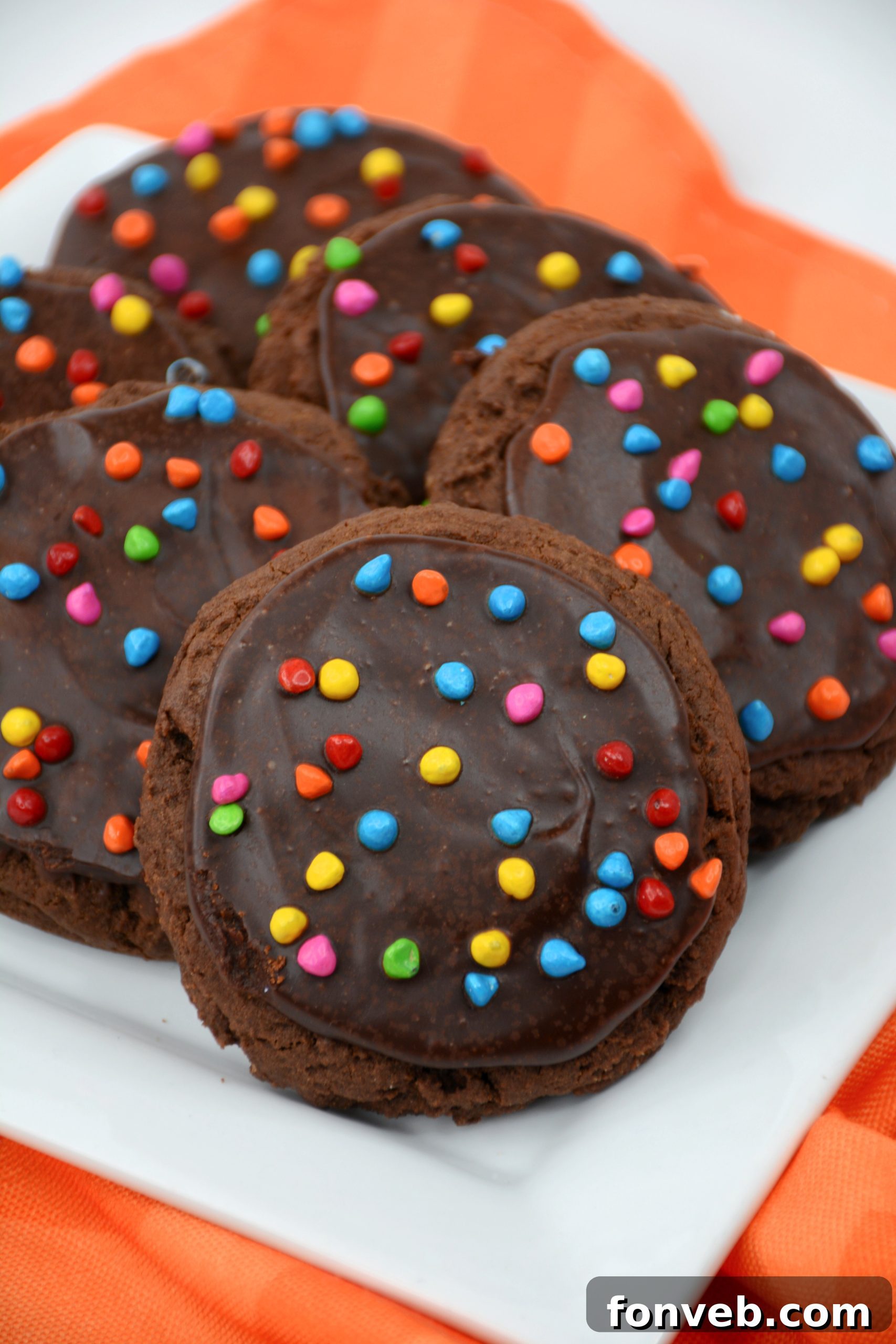 Freshly baked Cosmic Brownie Cookies with melted chocolate ganache and colorful sprinkles.
