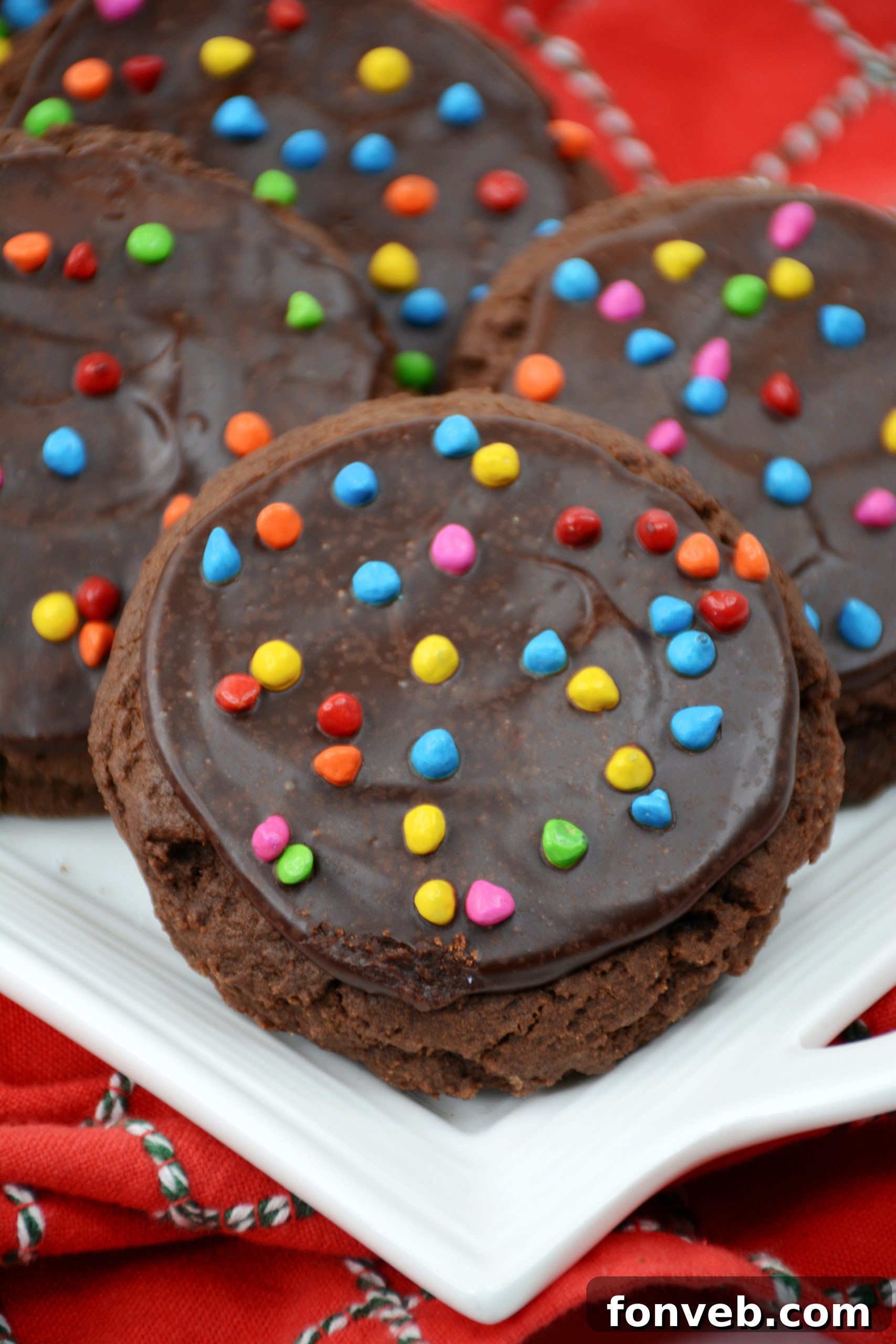 An overhead shot of multiple Cosmic Brownie Cookies on a dark surface.