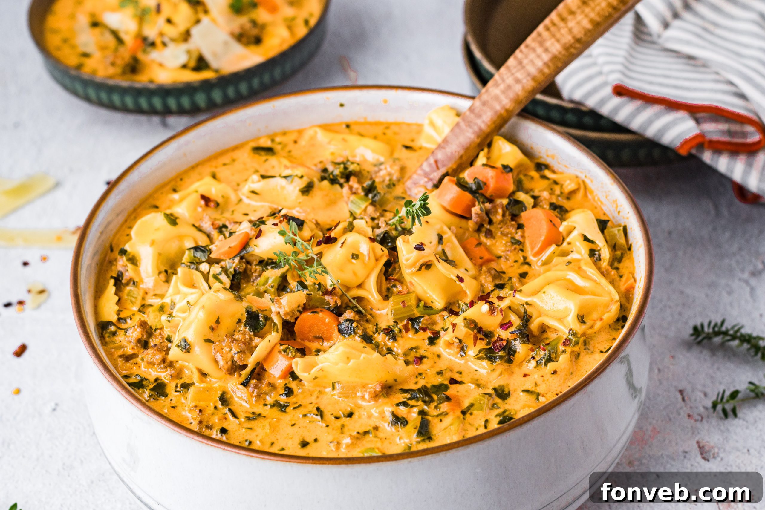 A bowl of hot tortellini soup ready to be served