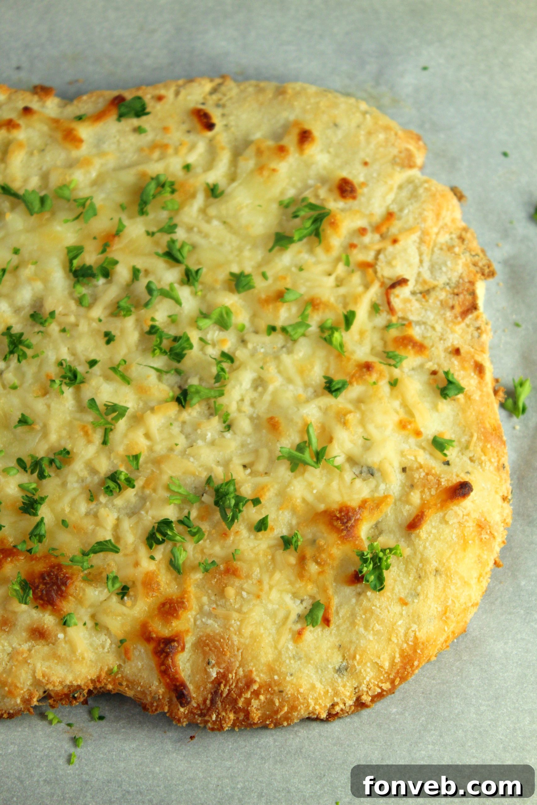 A plate of golden brown keto breadsticks, perfectly baked and ready to eat.