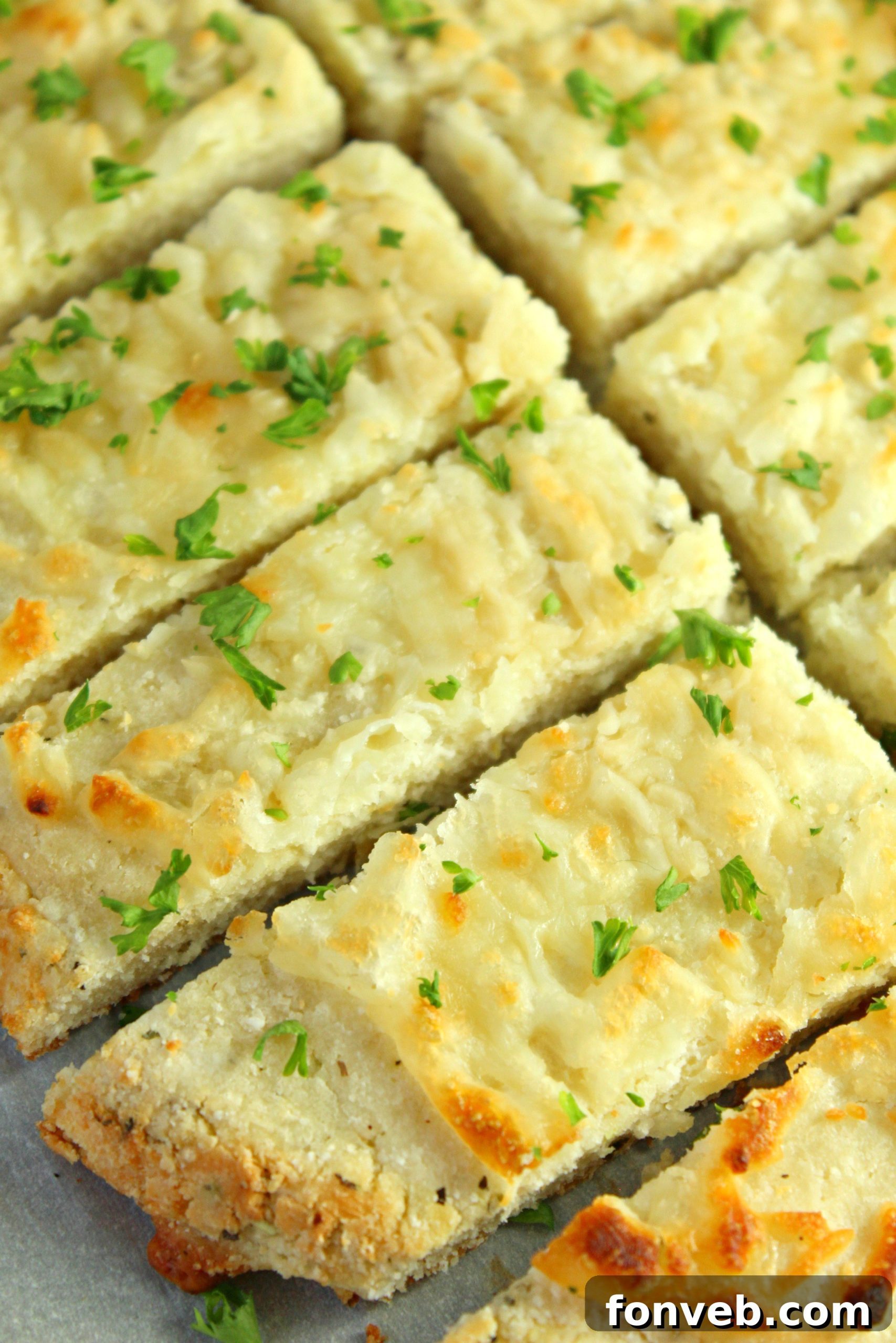 A bowl of shredded four cheese blend, ready to be incorporated into the dough.