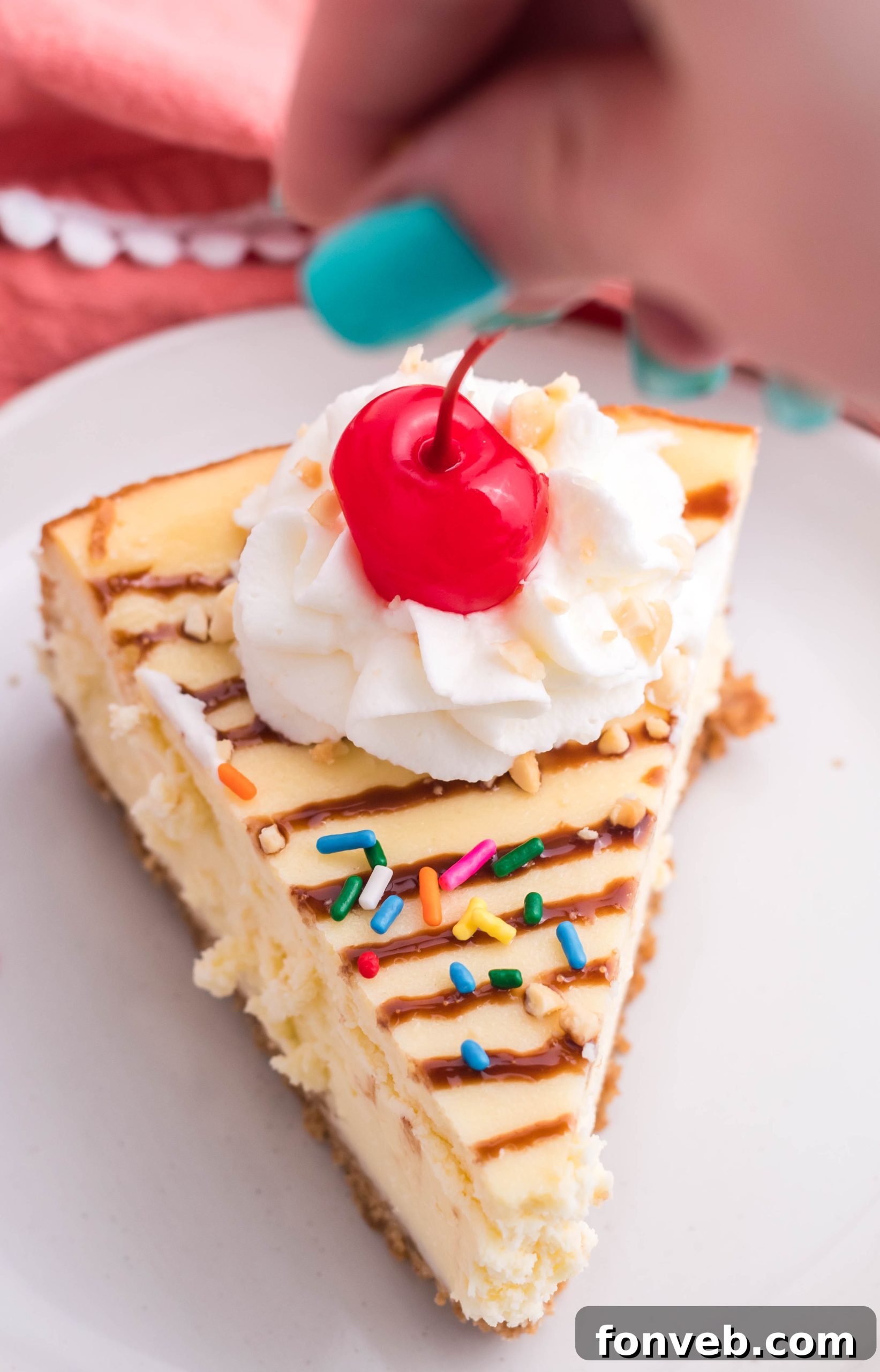 The fully decorated Banana Split Cheesecake, showcasing all the colorful toppings.