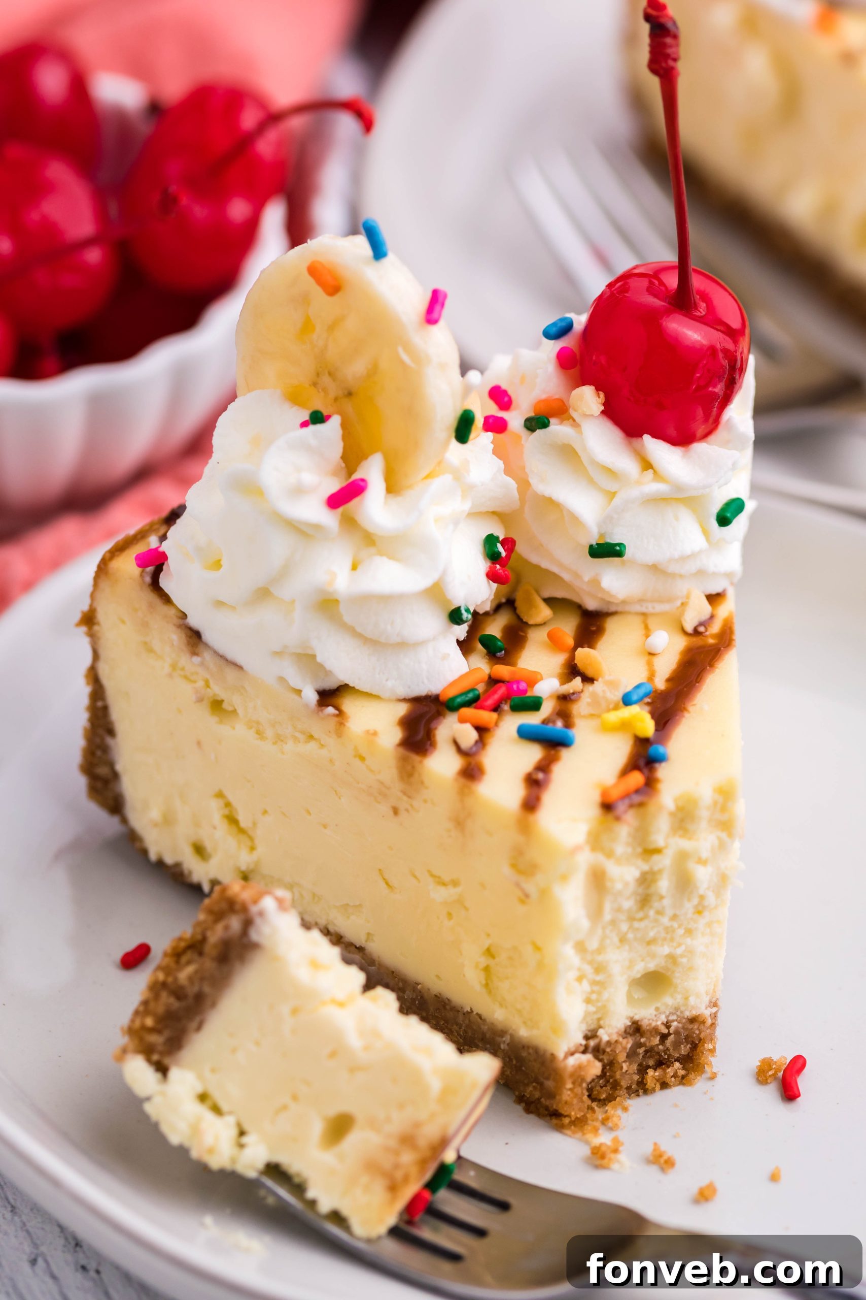 An overhead shot of the Banana Split Cheesecake with all its toppings, viewed from above.