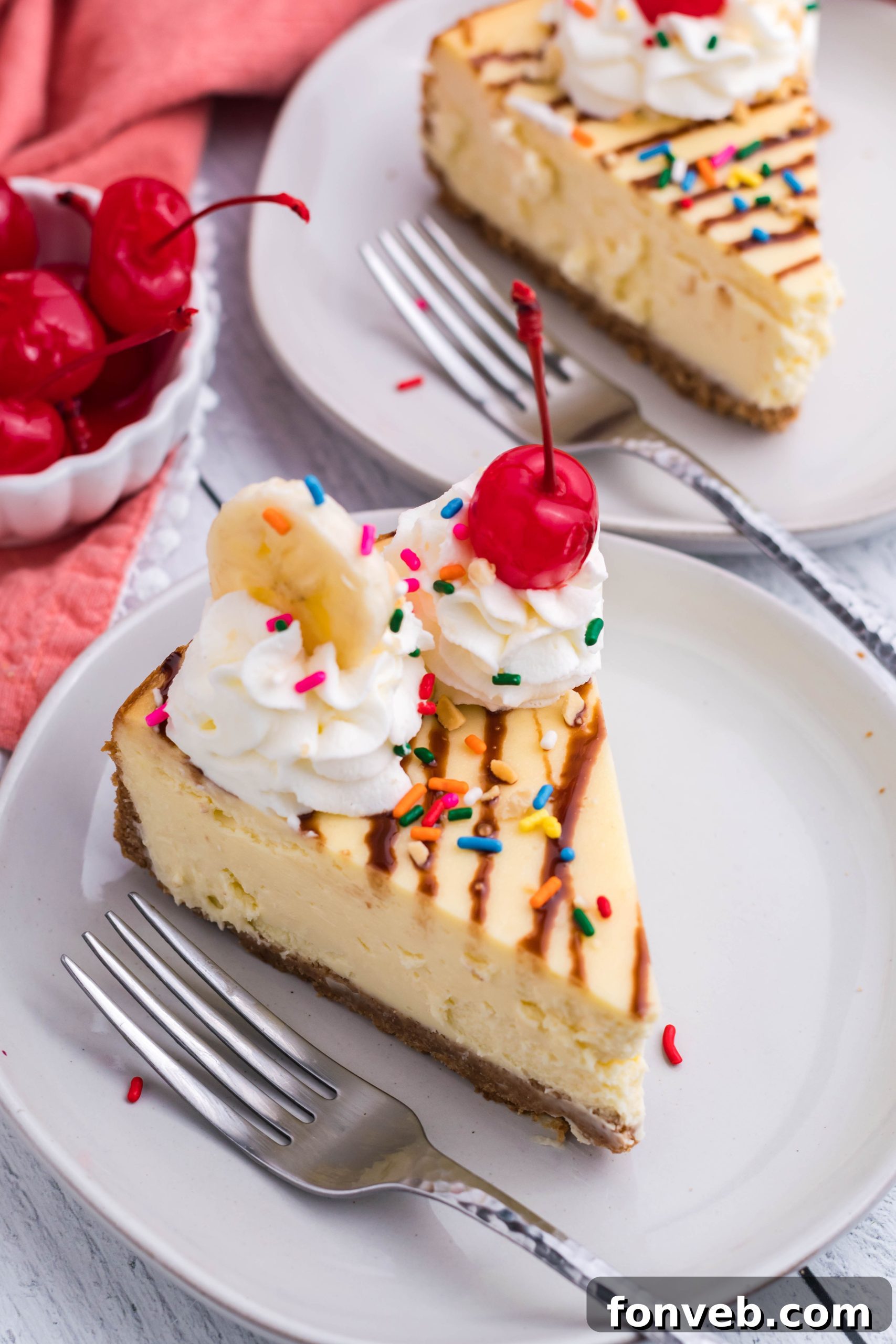 The Banana Split Cheesecake in its springform pan, showing the golden-brown crust and creamy filling before final decoration.