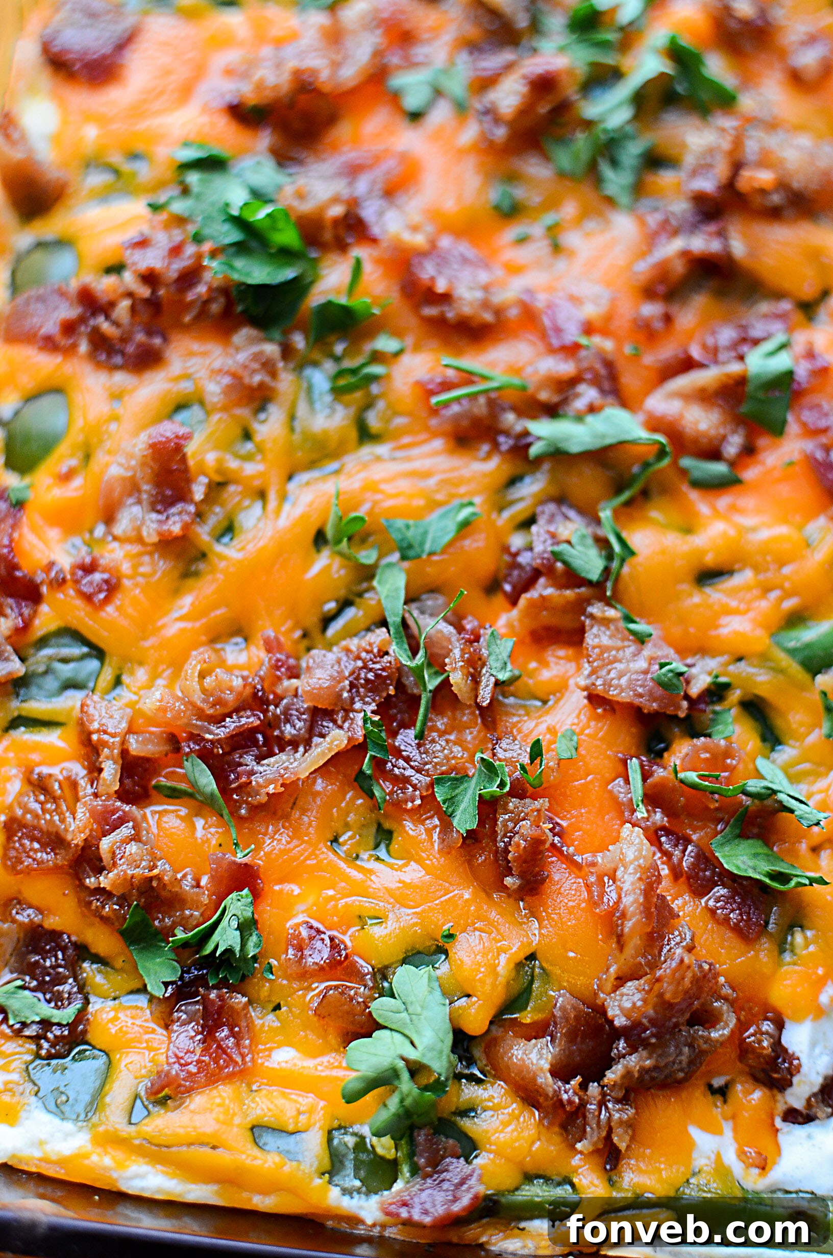 A dish of cooked bacon strips, ready to be crumbled for the casserole.