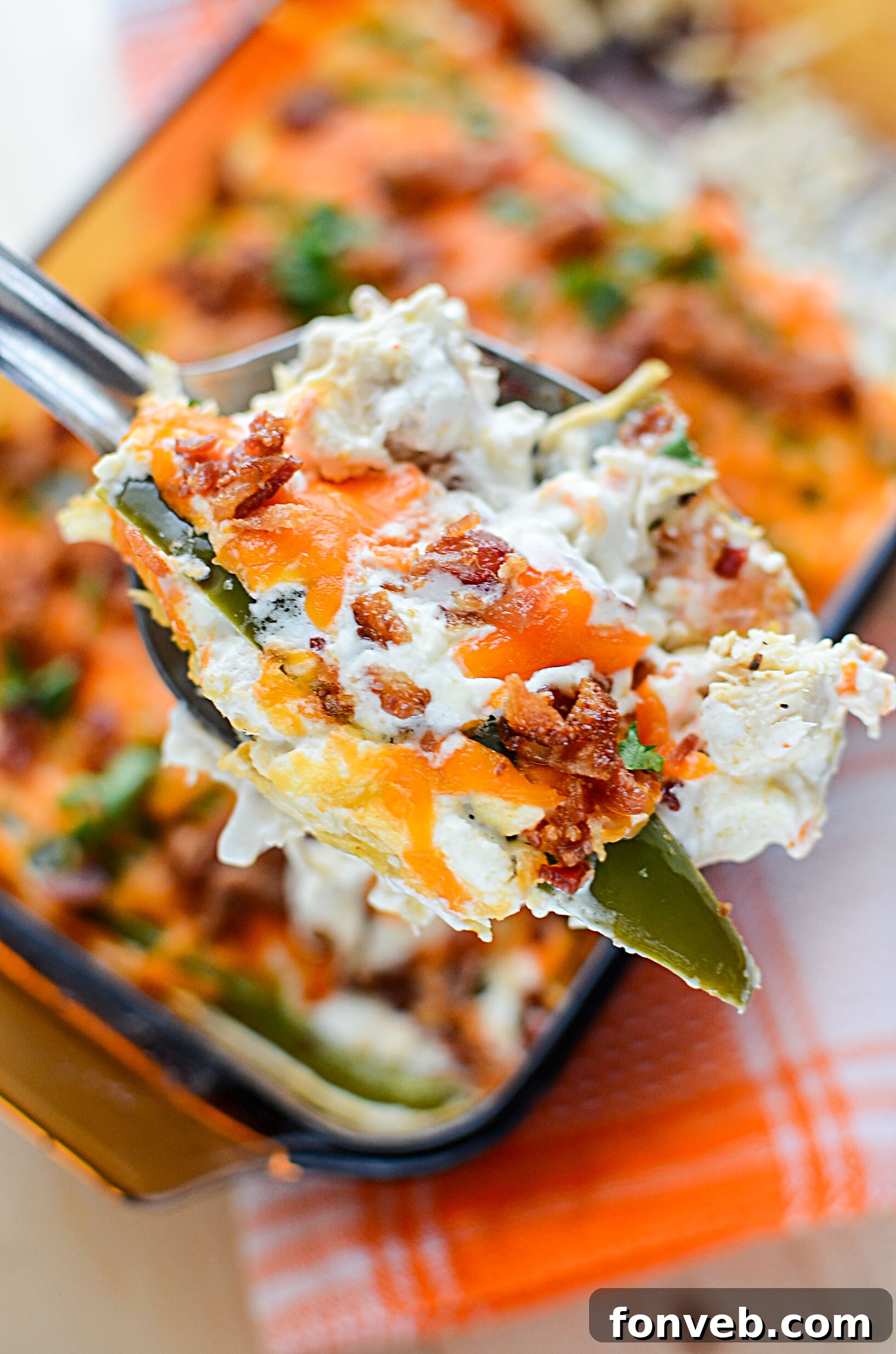 Cooked, shredded chicken in a bowl, ready for the casserole.