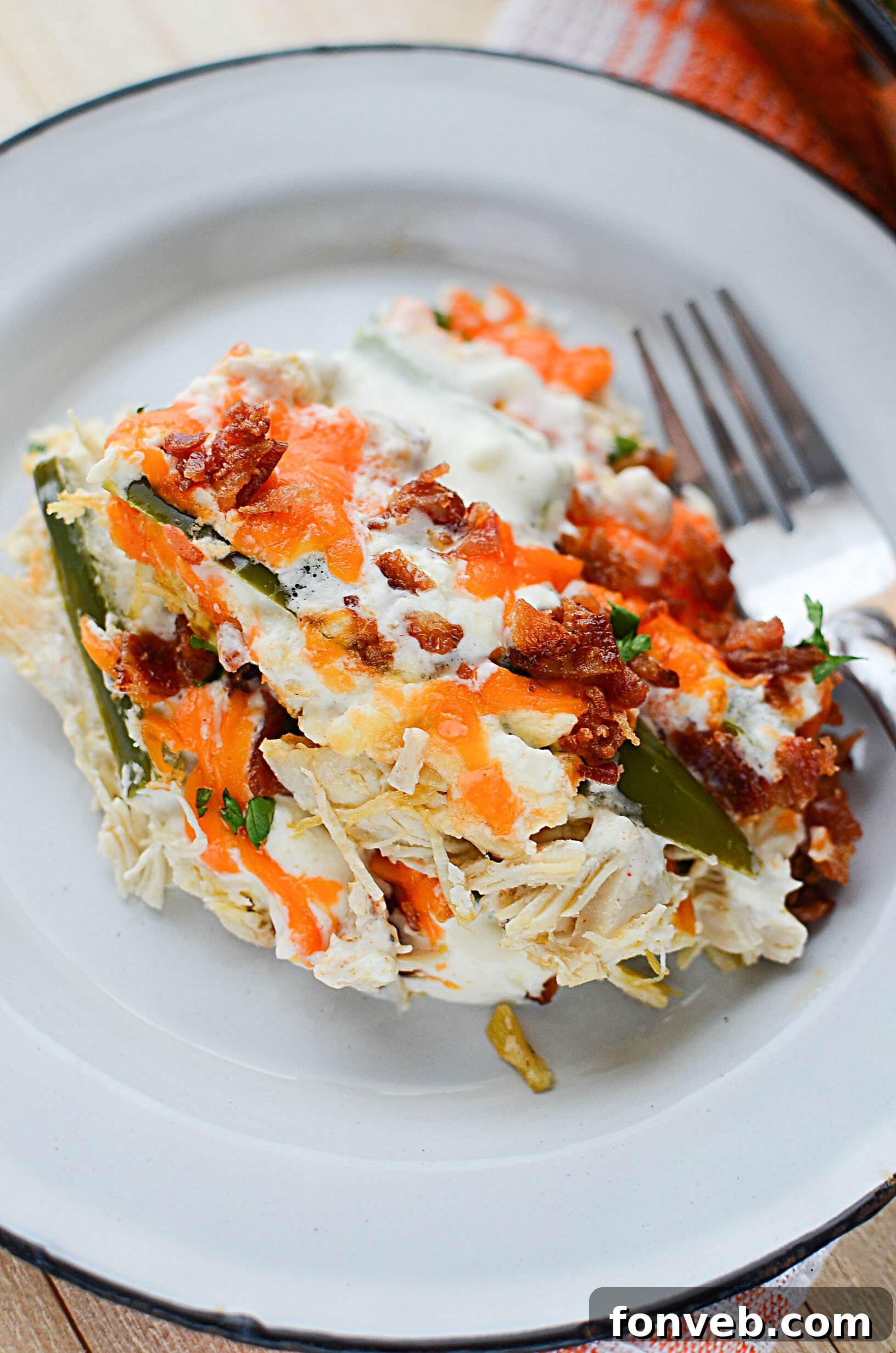 A stand mixer with a paddle attachment, demonstrating how to shred chicken efficiently.