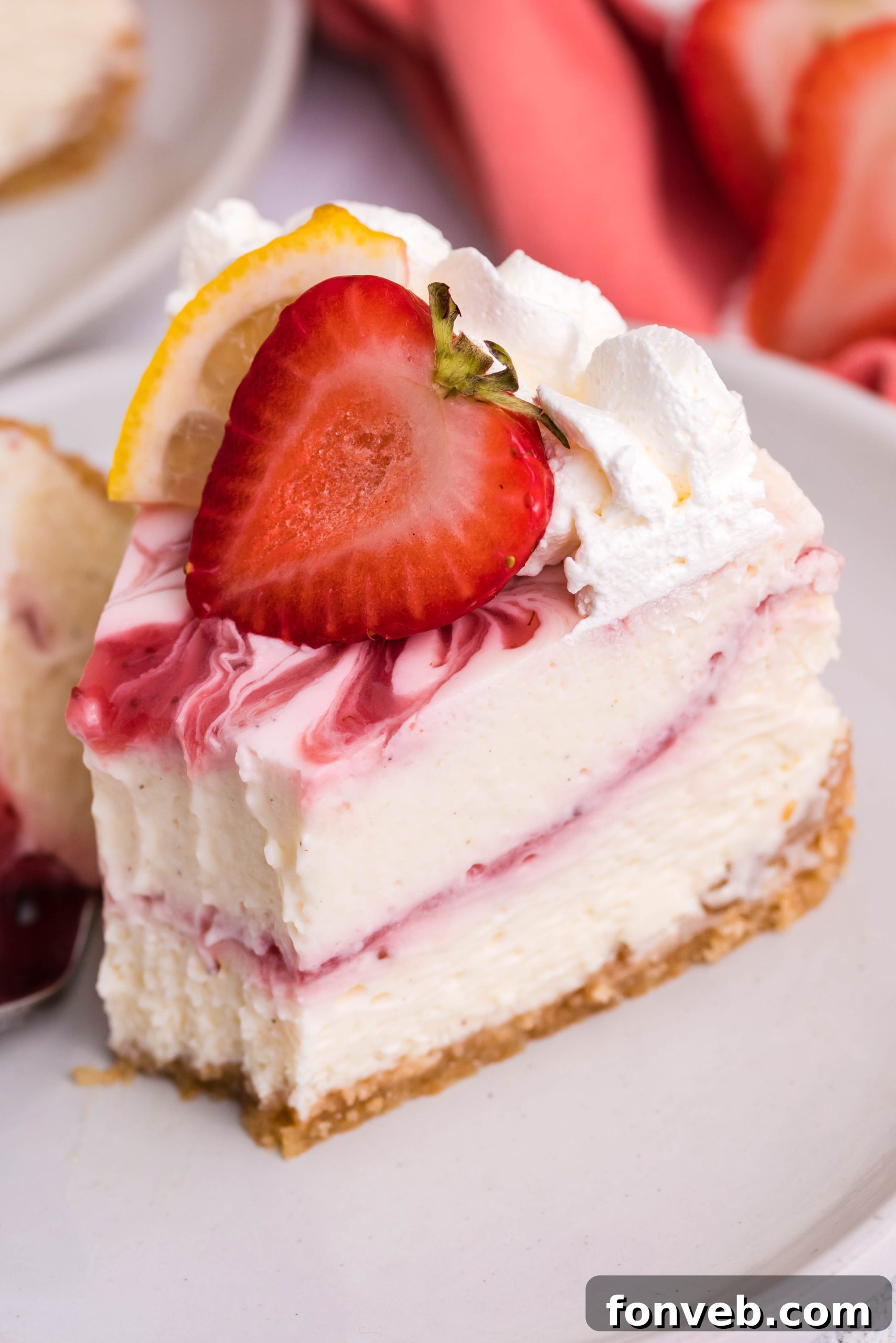 A bowl of fresh, chopped strawberries, ready for the cheesecake swirl.