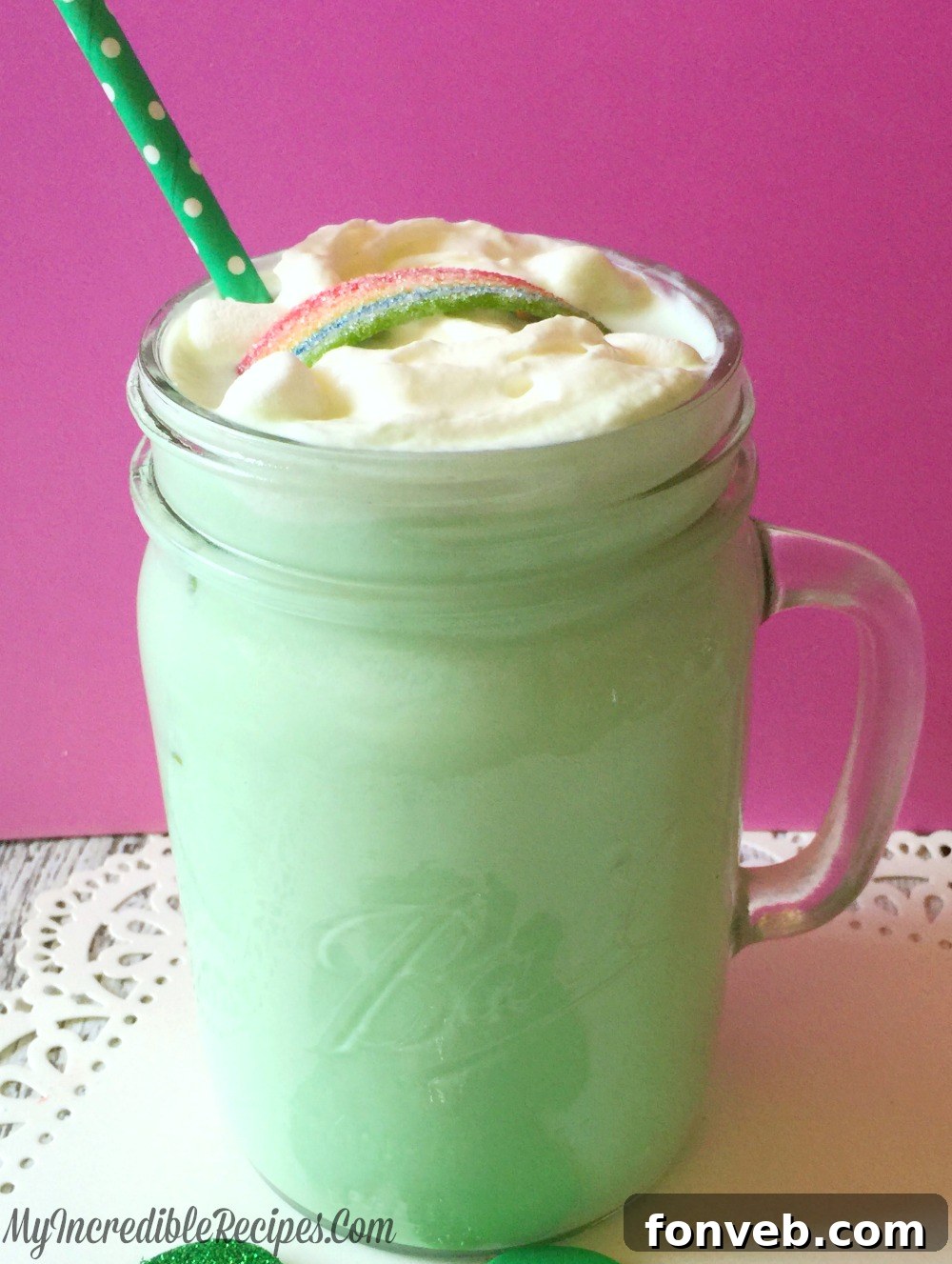 Closeup of a Shamrock Cocoa drink with a festive rainbow candy garnish, reminiscent of a popular mint shake