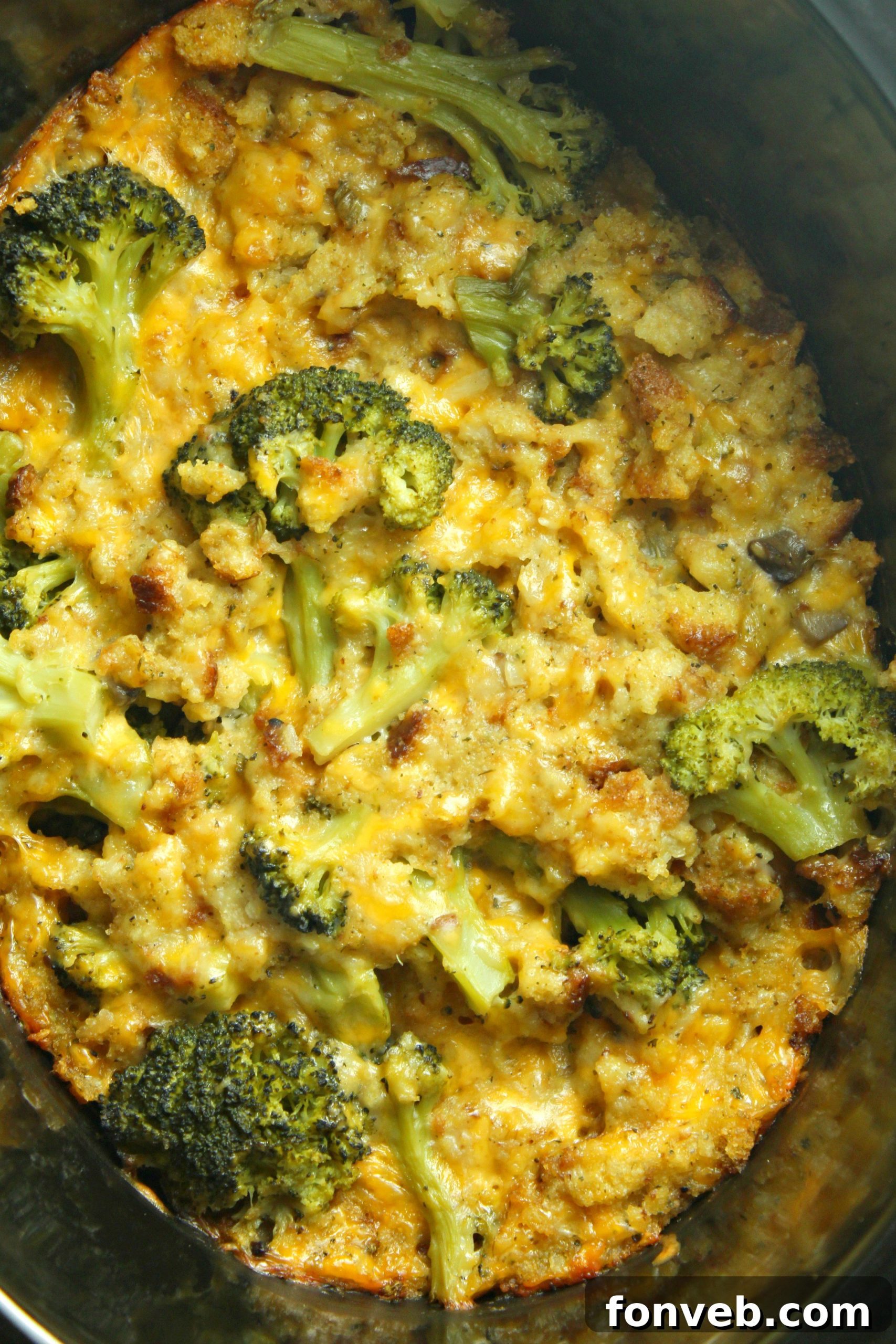 Close-up of bubbling cheesy chicken and broccoli casserole in a slow cooker