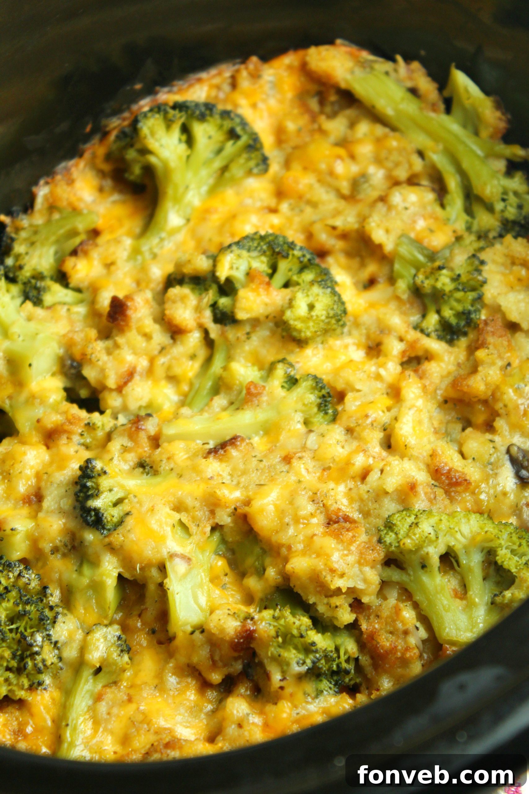 Mixing bowl with chicken, broccoli, and other casserole ingredients