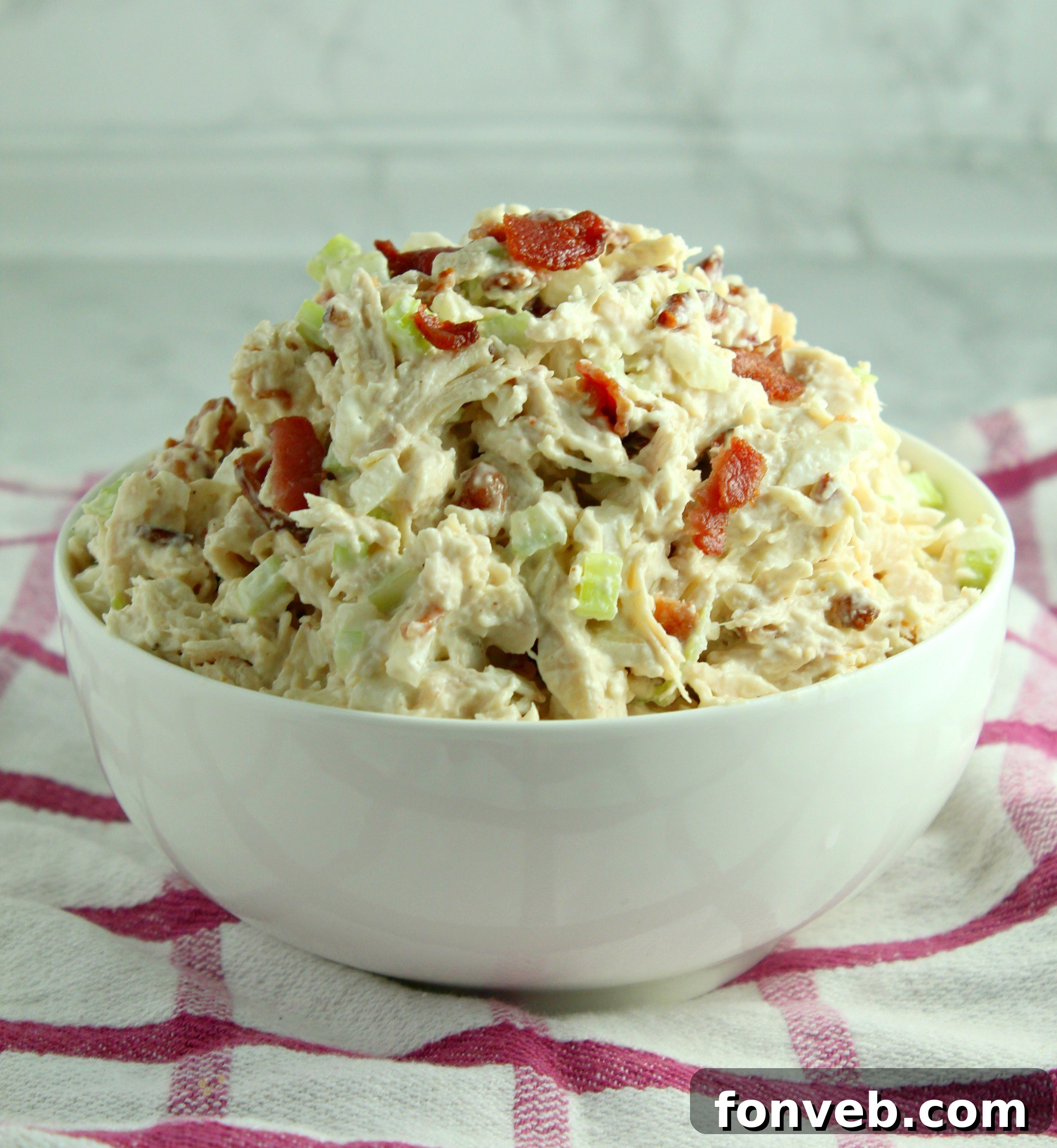 Homemade Willow Tree Bacon Chicken Salad 6 A serving of Willow Tree Chicken Salad with bacon on toast, garnished with herbs