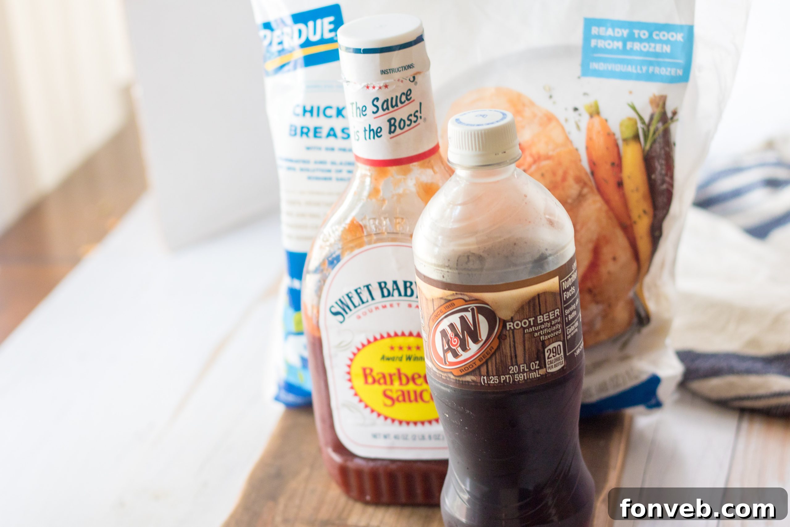 Close up of shredded Slow Cooker Root Beer Chicken in a serving bowl