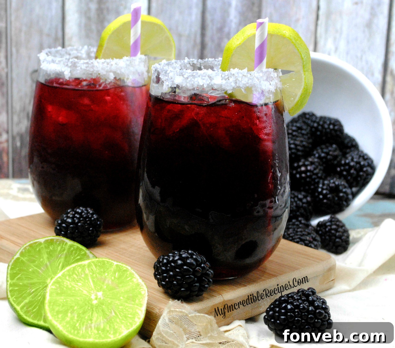 Beautifully crafted Blackberry Margarita cocktail in a glass with a lime wheel