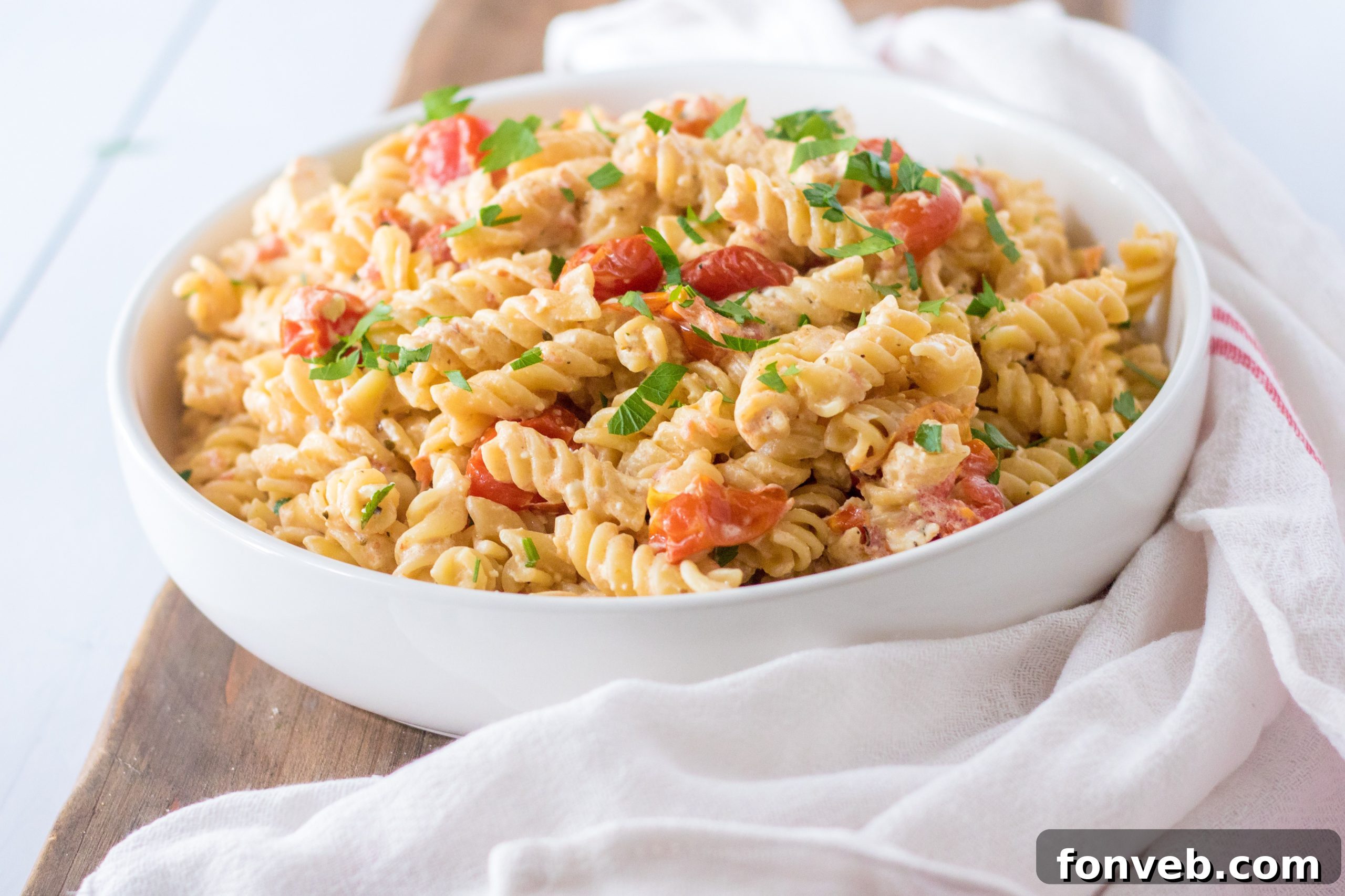 A large portion of the prepared Slow Cooker Tomato and Feta Pasta, showing the texture and colors of the dish.