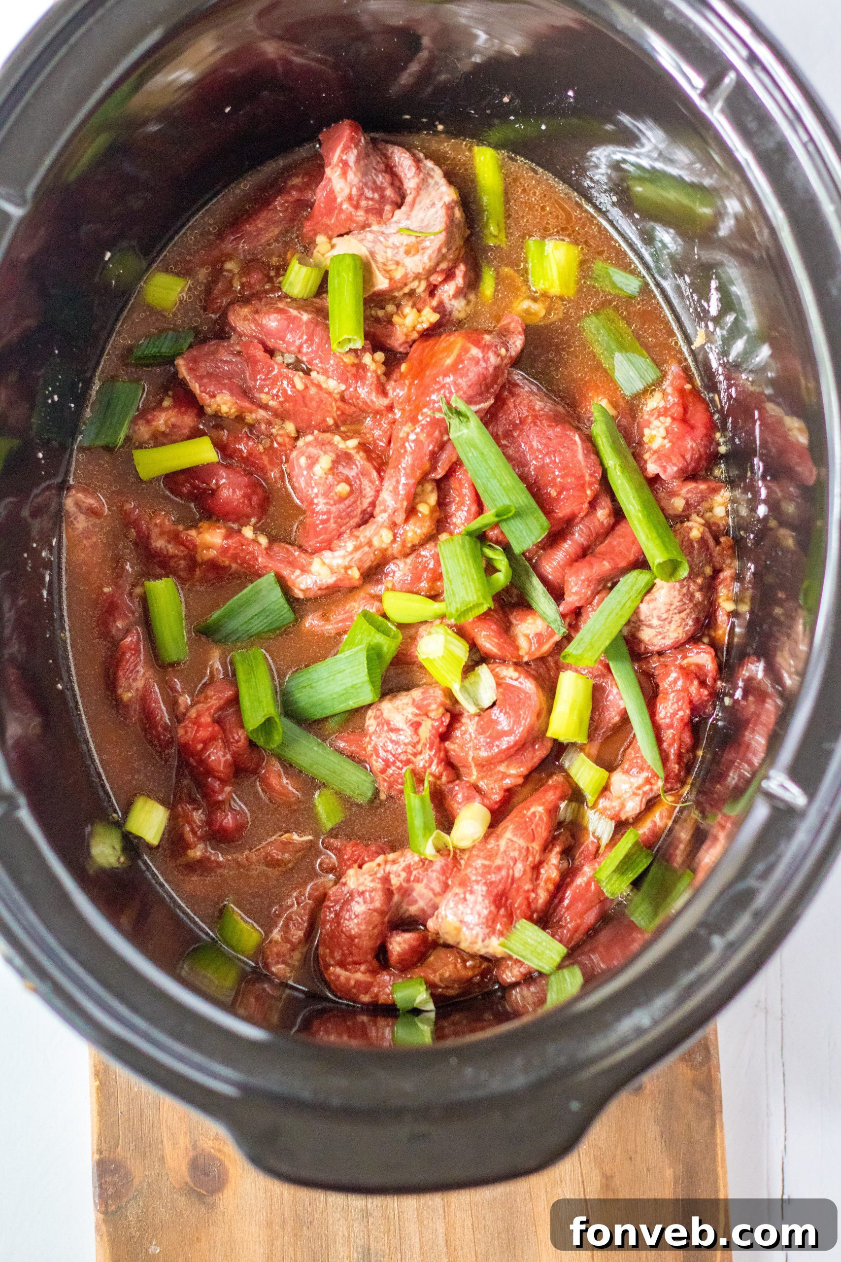 Slow Cooker Mongolian Beef Delight 4 Close-up of Slow Cooker Mongolian Beef with green onions