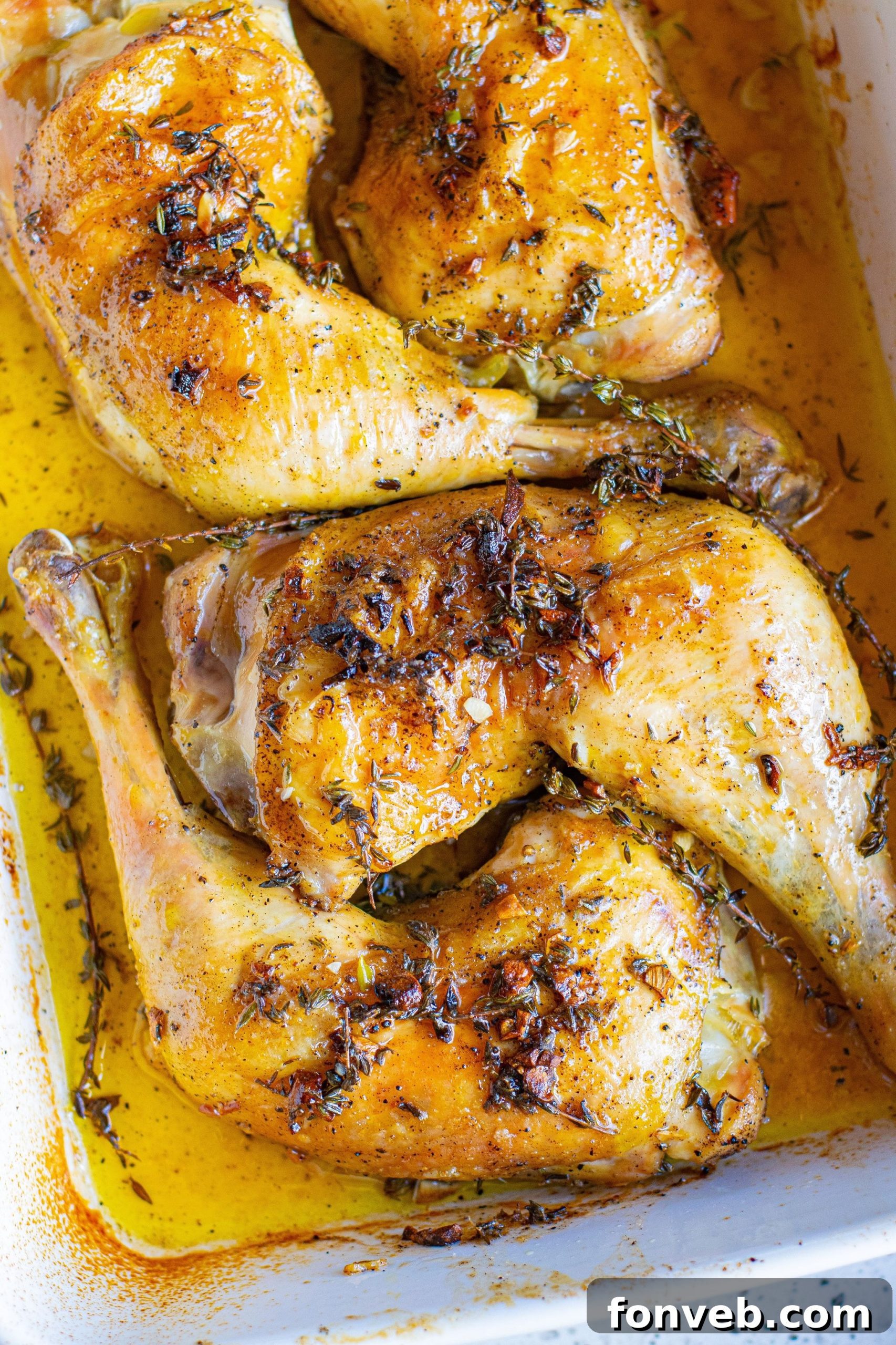Garlic Butter Baked Chicken Thighs, fresh out of the oven, golden brown and glistening with butter.