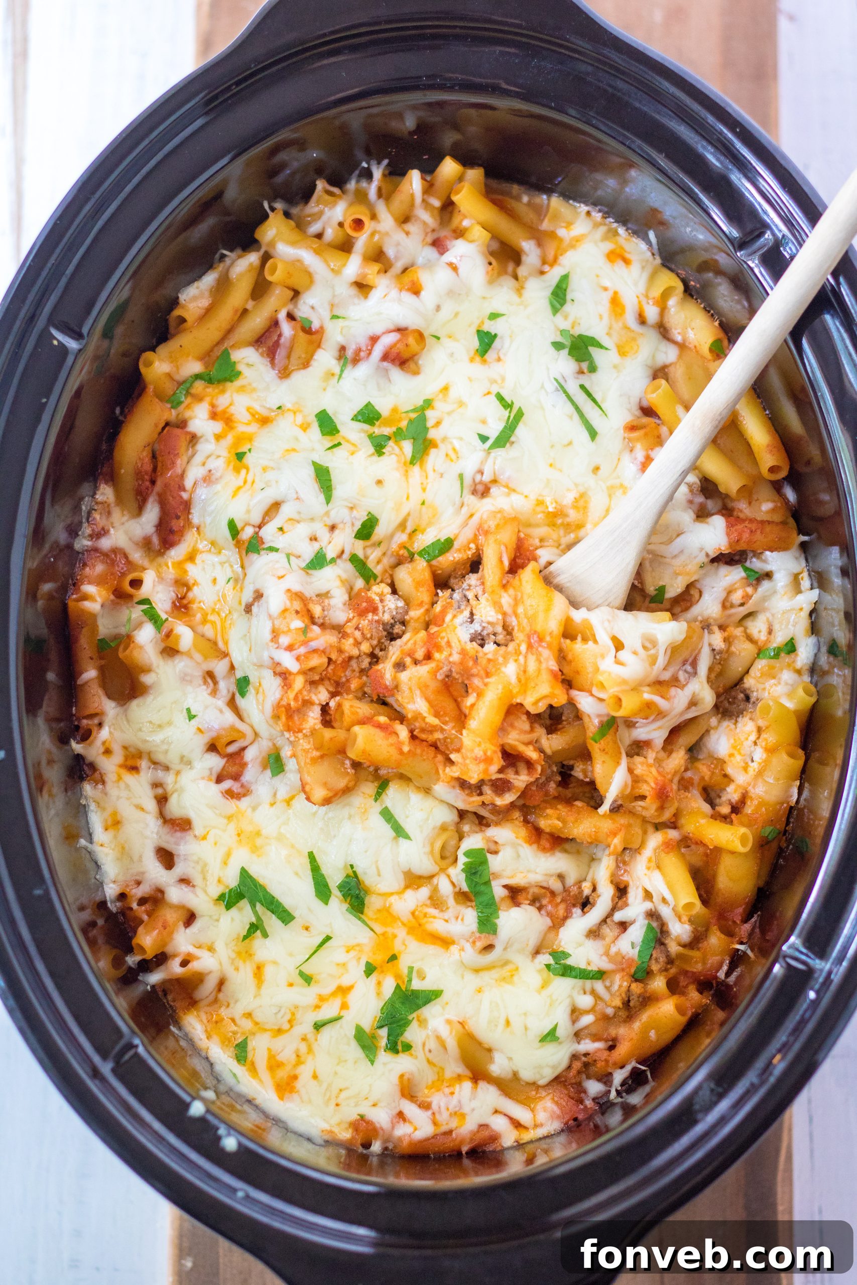 A close-up shot of the textures and layers within the Slow Cooker Cheesy Baked Pasta.