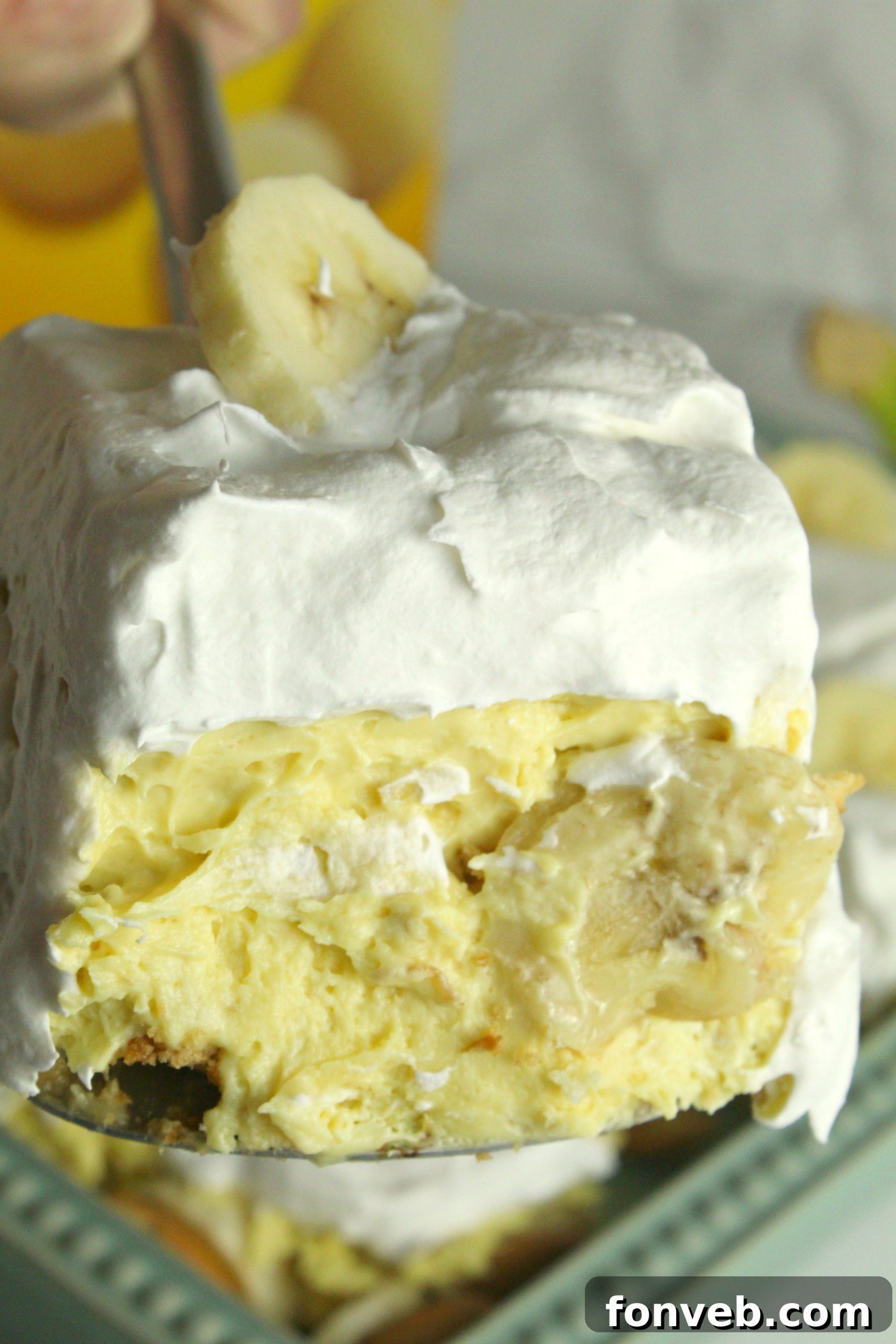 Simple Chilled Banana Pudding 14 A scoop of Easy No-Bake Banana Pudding on a small plate, ready to be enjoyed.