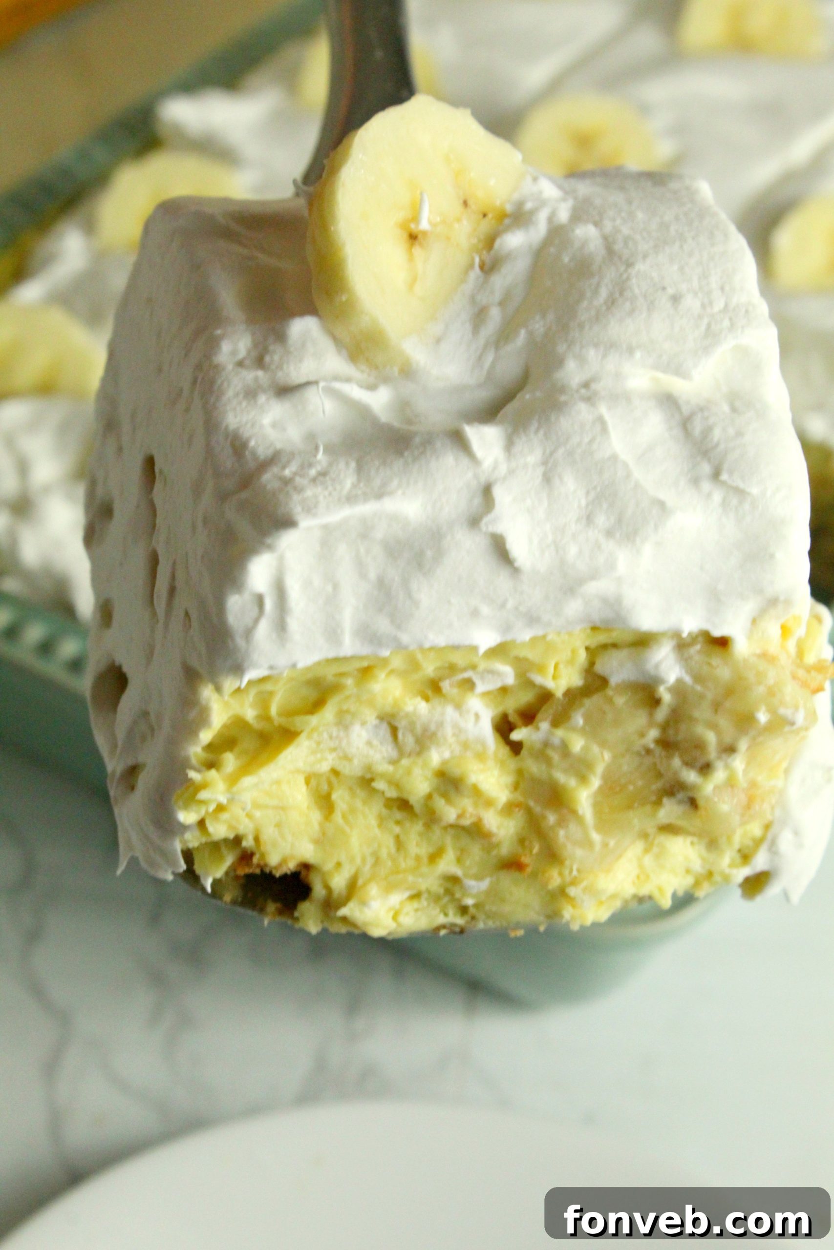 Simple Chilled Banana Pudding 3 Layers of creamy pudding, vanilla wafers, and fresh banana slices visible in a glass dish.