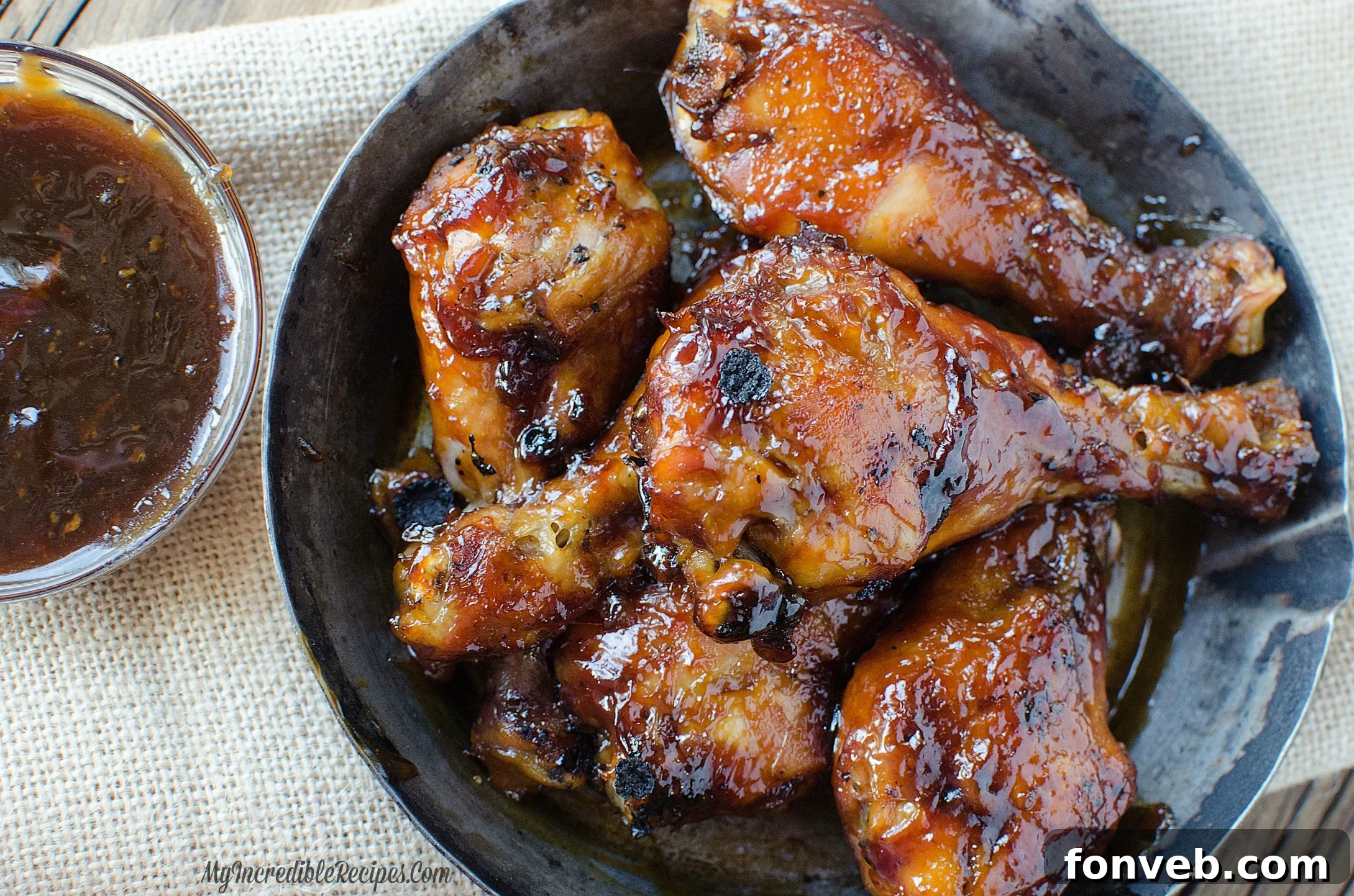Cooked chicken legs with sauce in a pan