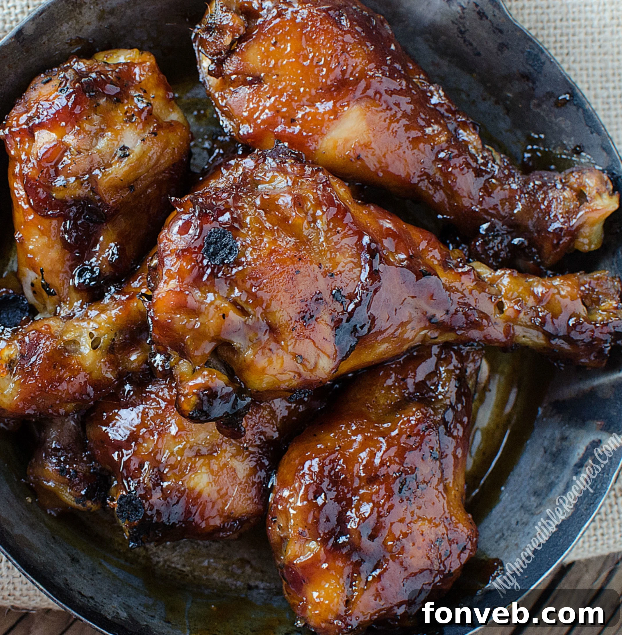 Chicken legs on a baking sheet, ready for broiling