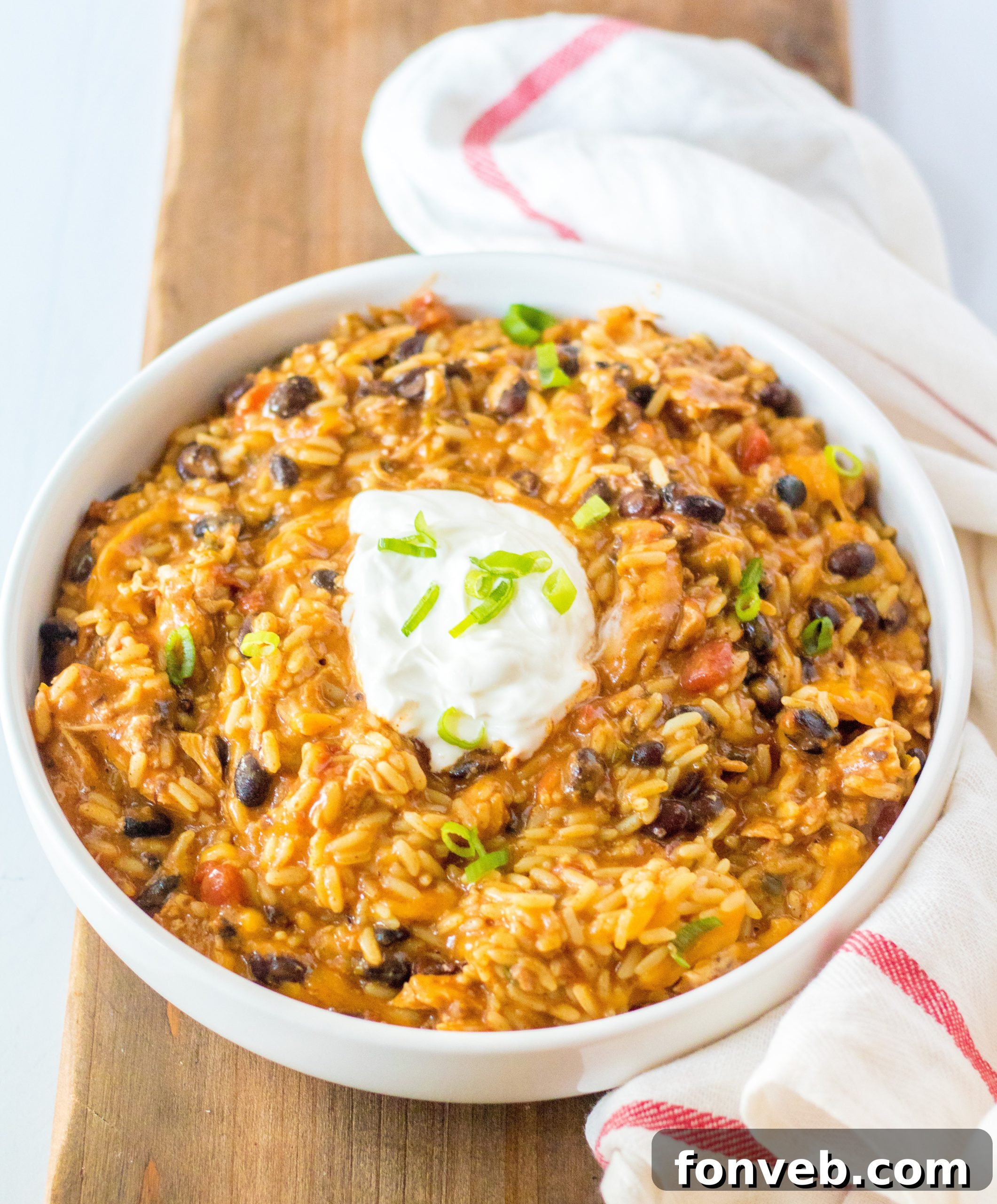Creamy Slow Cooker Cheesy Chicken Taco Rice 2 Delicious Slow Cooker Cheesy Chicken Taco Rice with sour cream and cilantro