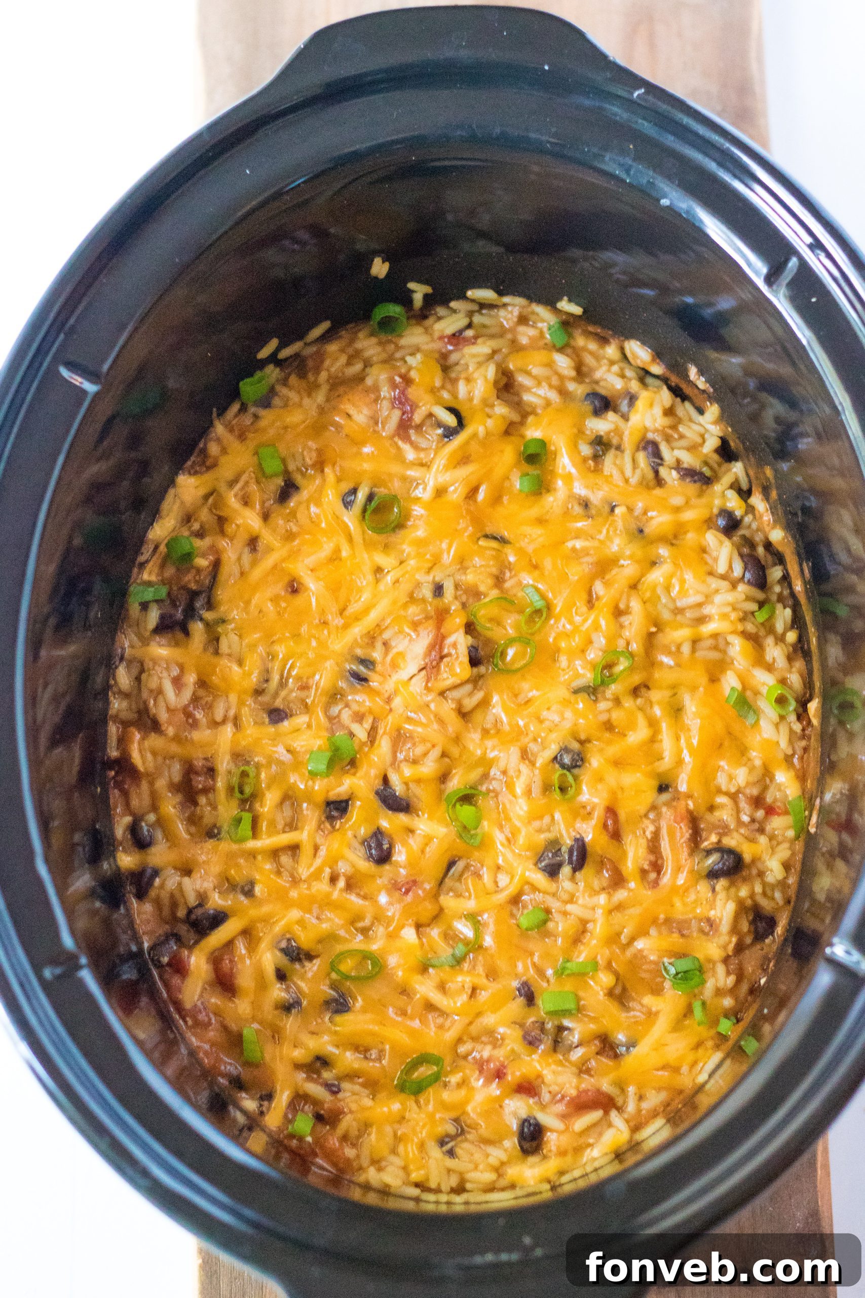 Creamy Slow Cooker Cheesy Chicken Taco Rice 5 Cooked Slow Cooker Cheesy Chicken Taco Rice simmering in the slow cooker