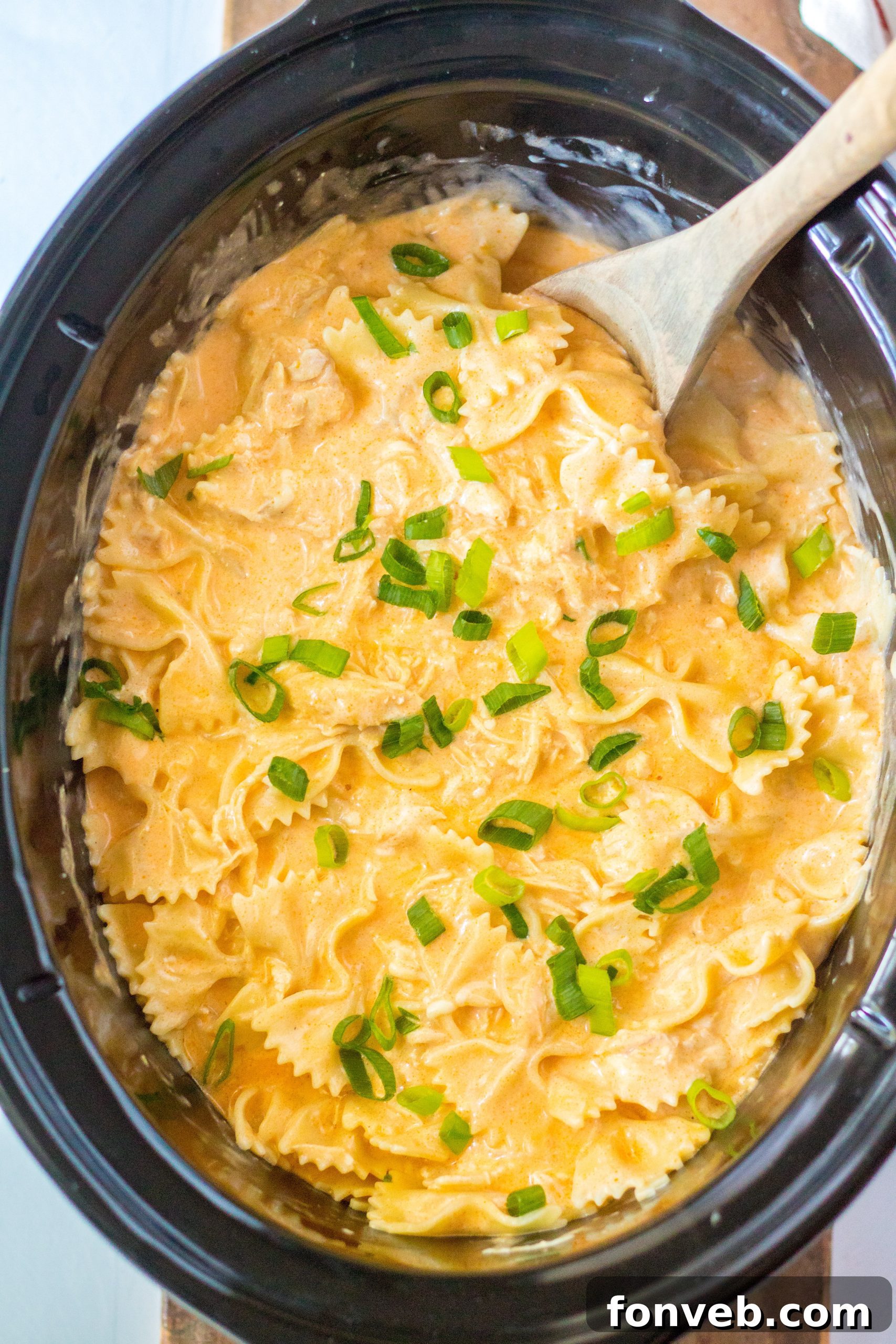 Bottles of ranch and blue cheese dressing on a countertop.