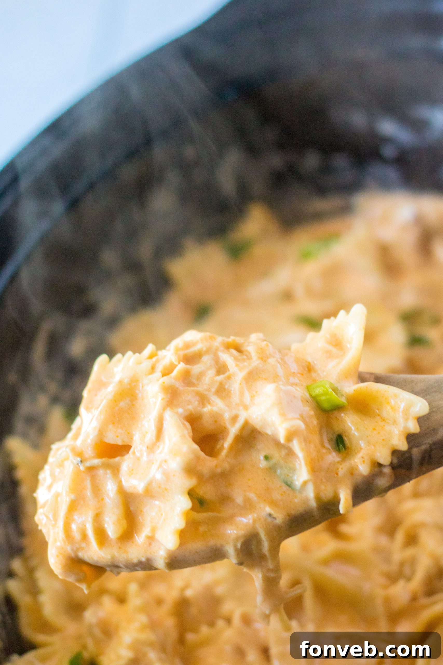 Variety of pasta shapes in individual bowls.