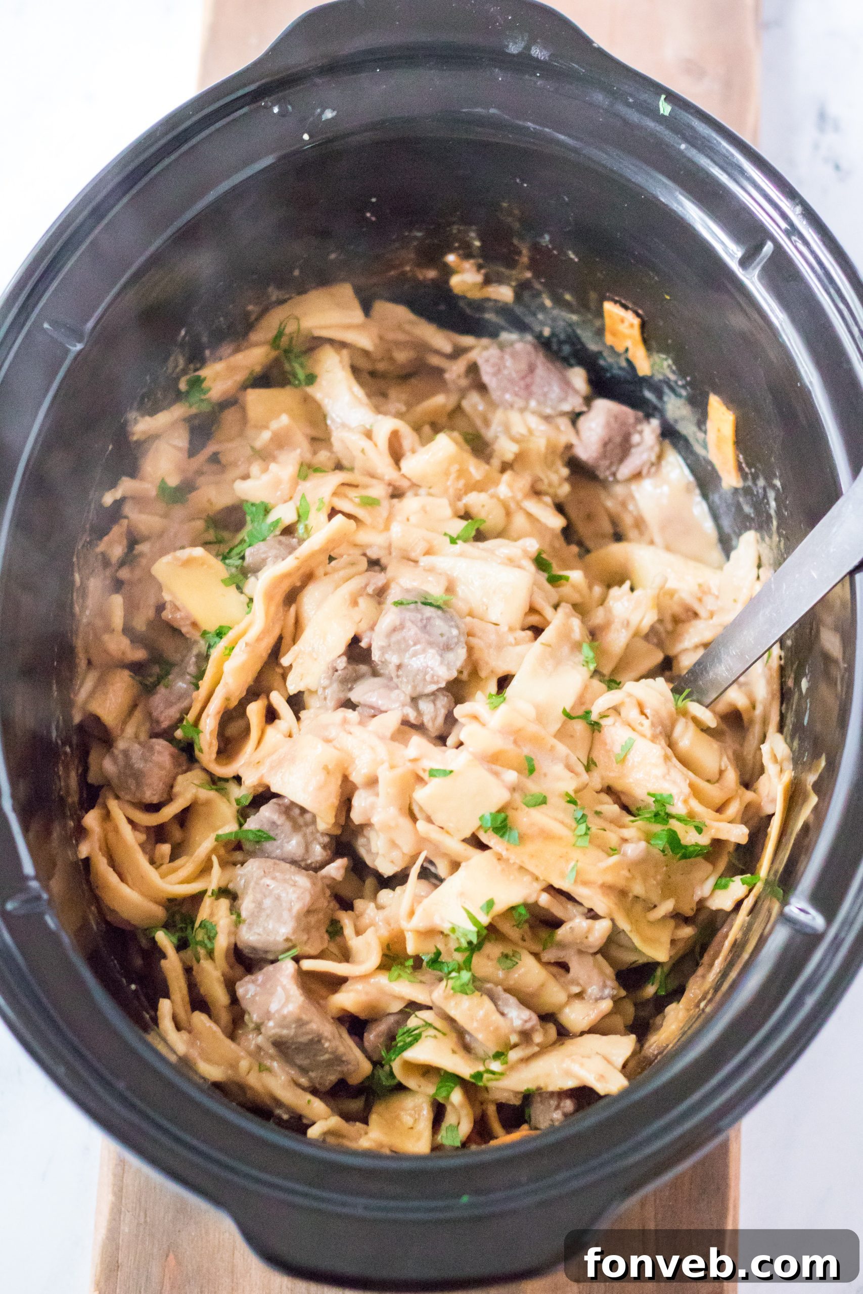 Crock Pot with Beef & Noodles cooking