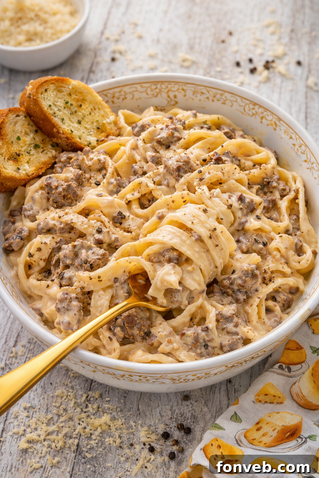 Crock Pot Beef & Noodles in a rustic white bowl