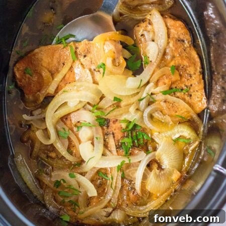 Final plated image of Slow Cooker Pork Chops and Onions, ready to serve.