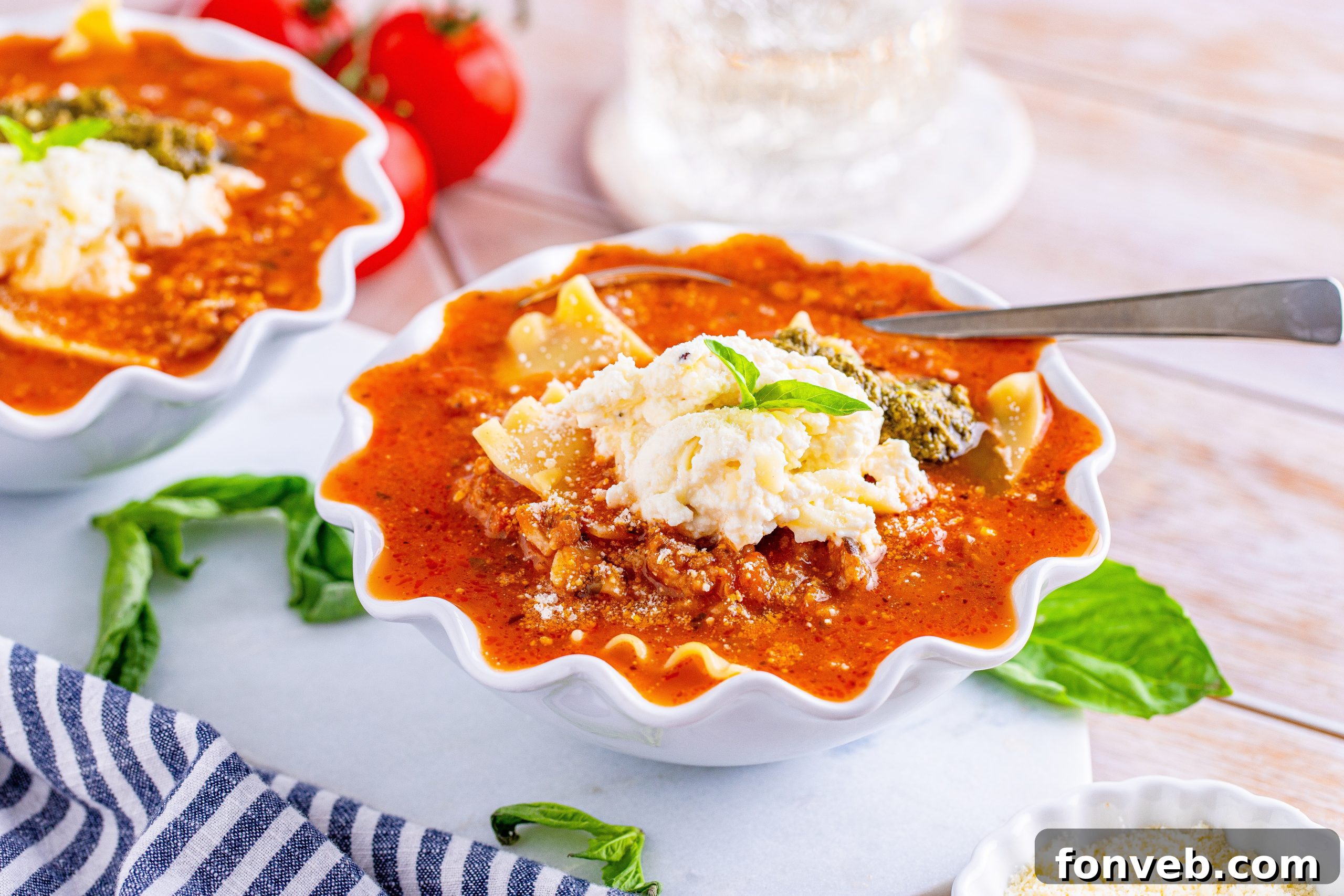 Two bowls of Lasagna Soup, garnished and ready to eat