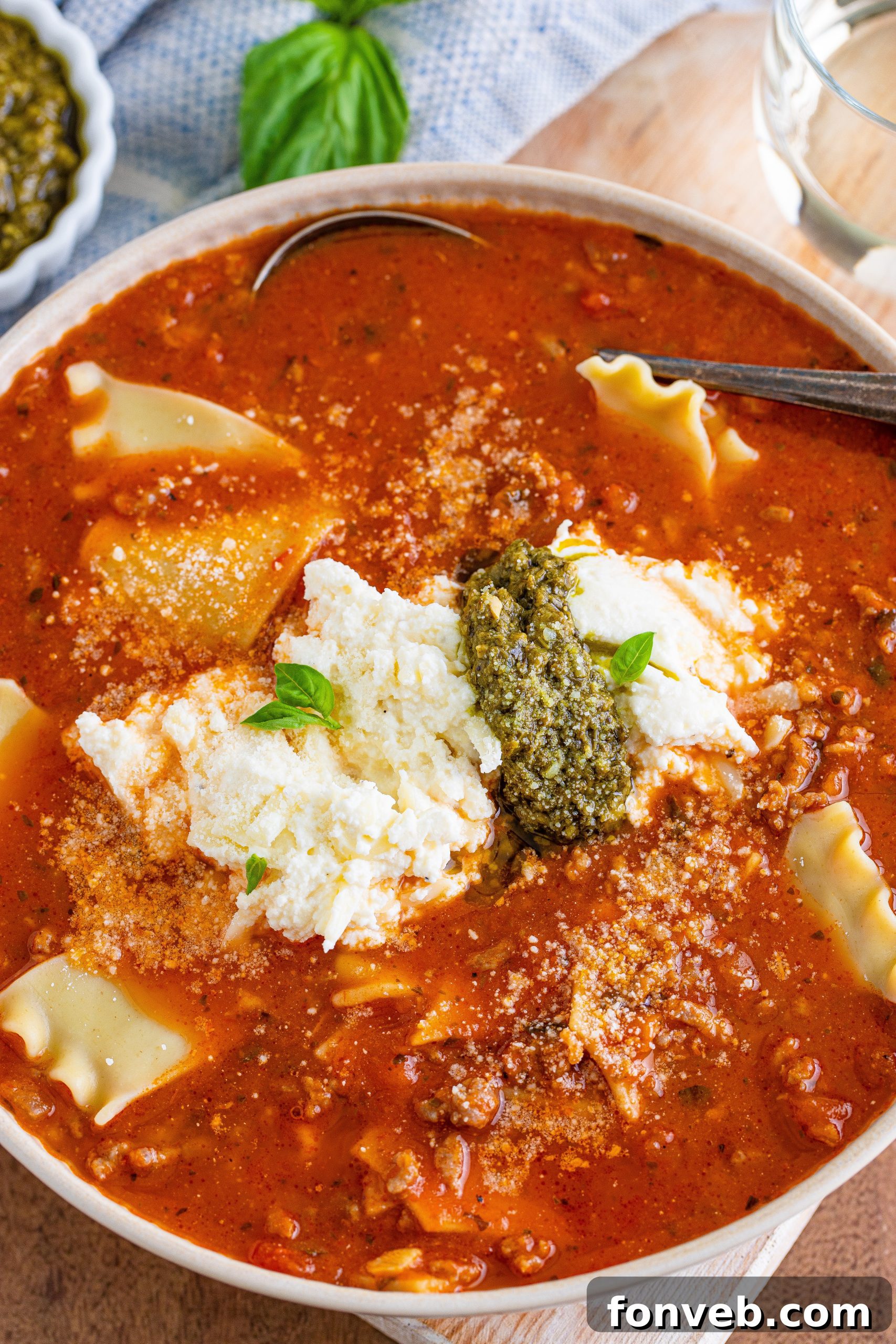 A bowl of Lasagna Soup ready to be served, topped with cheese