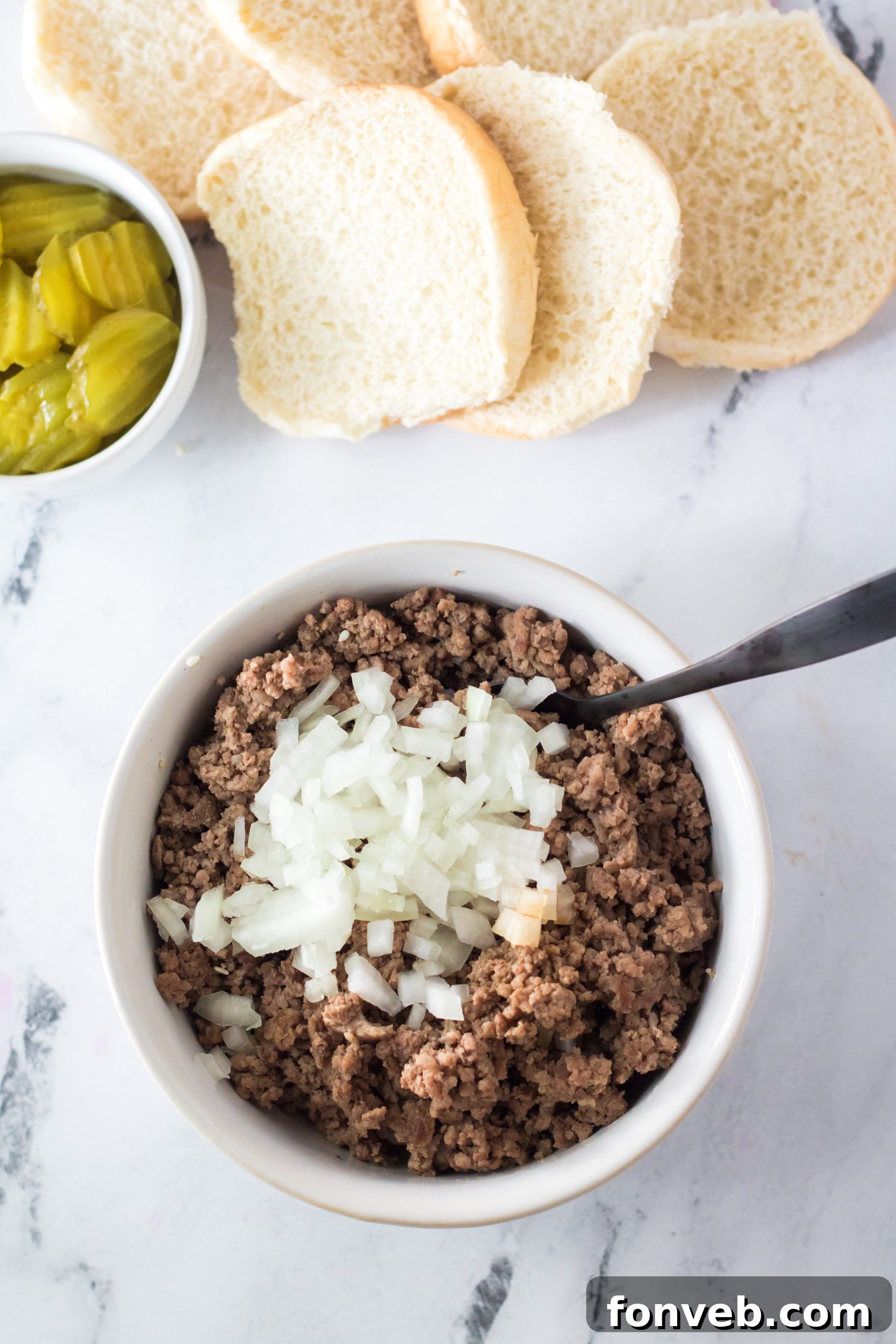 A serving of Big Mac Cups on a platter, showcasing their golden-brown buns and melted cheese.