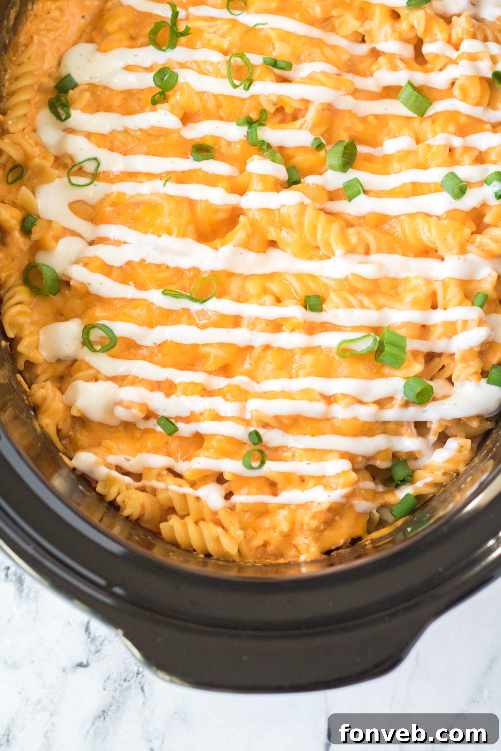 Tangy Slow Cooker Buffalo Chicken Mac and Cheese 11 A bottle of hot sauce, a key ingredient for the buffalo flavor.