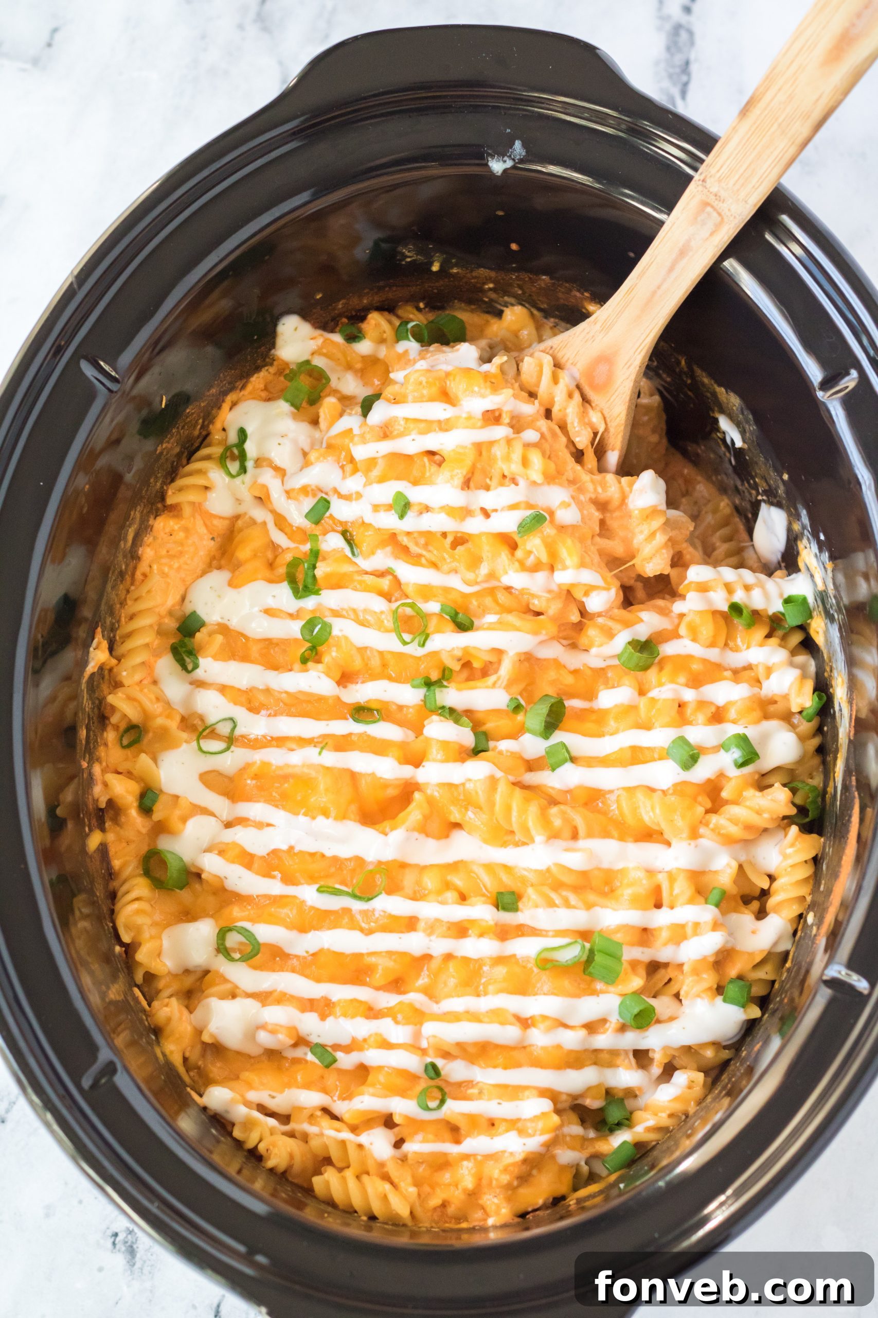 Tangy Slow Cooker Buffalo Chicken Mac and Cheese 10 Various vegetables, suggesting possible additions to the mac and cheese.