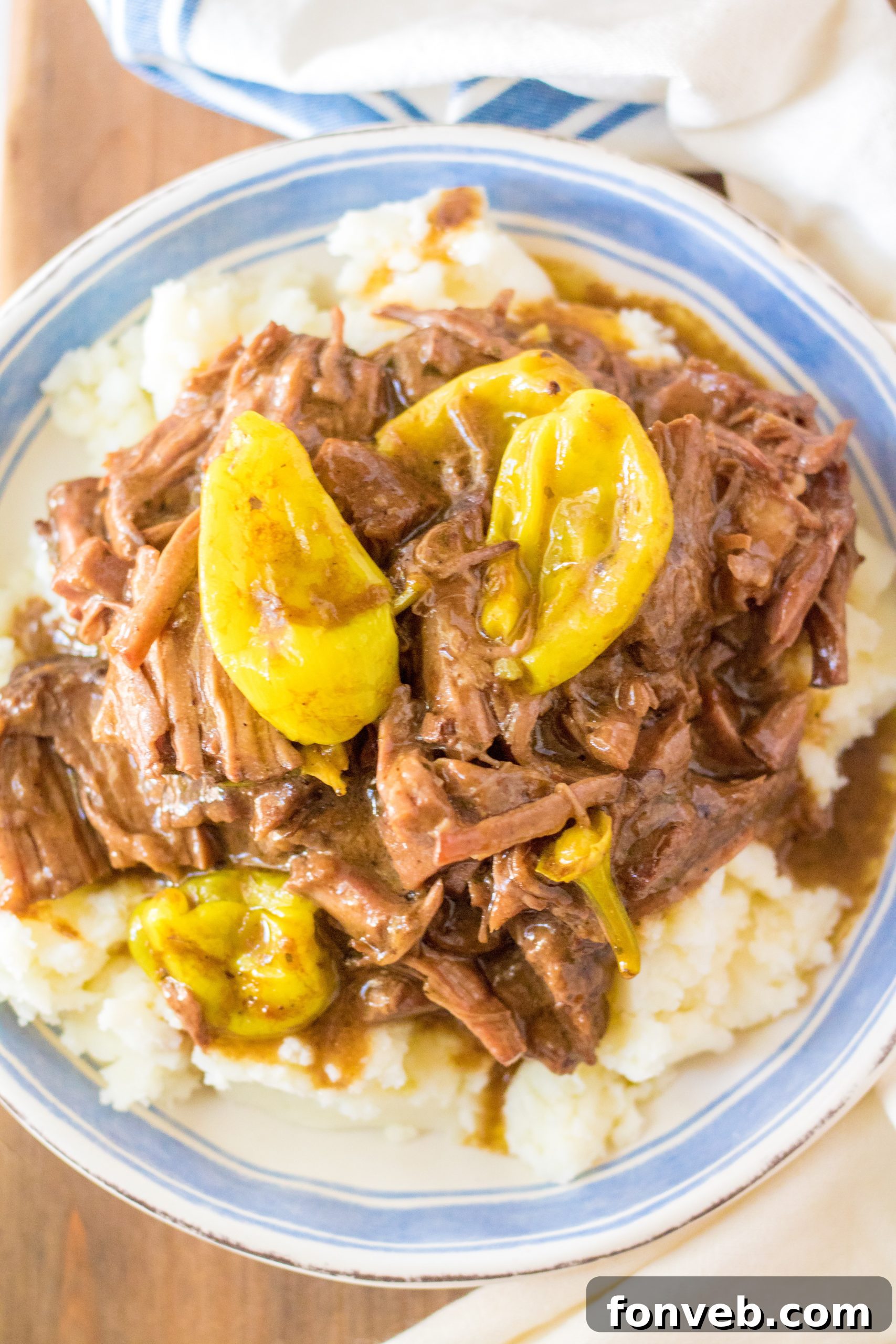 Melt-in-Your-Mouth Slow Cooker Mississippi Pot Roast 2 Slow Cooker Mississippi Pot Roast cooked to perfection, showcasing tender, shredded meat in a rich sauce.