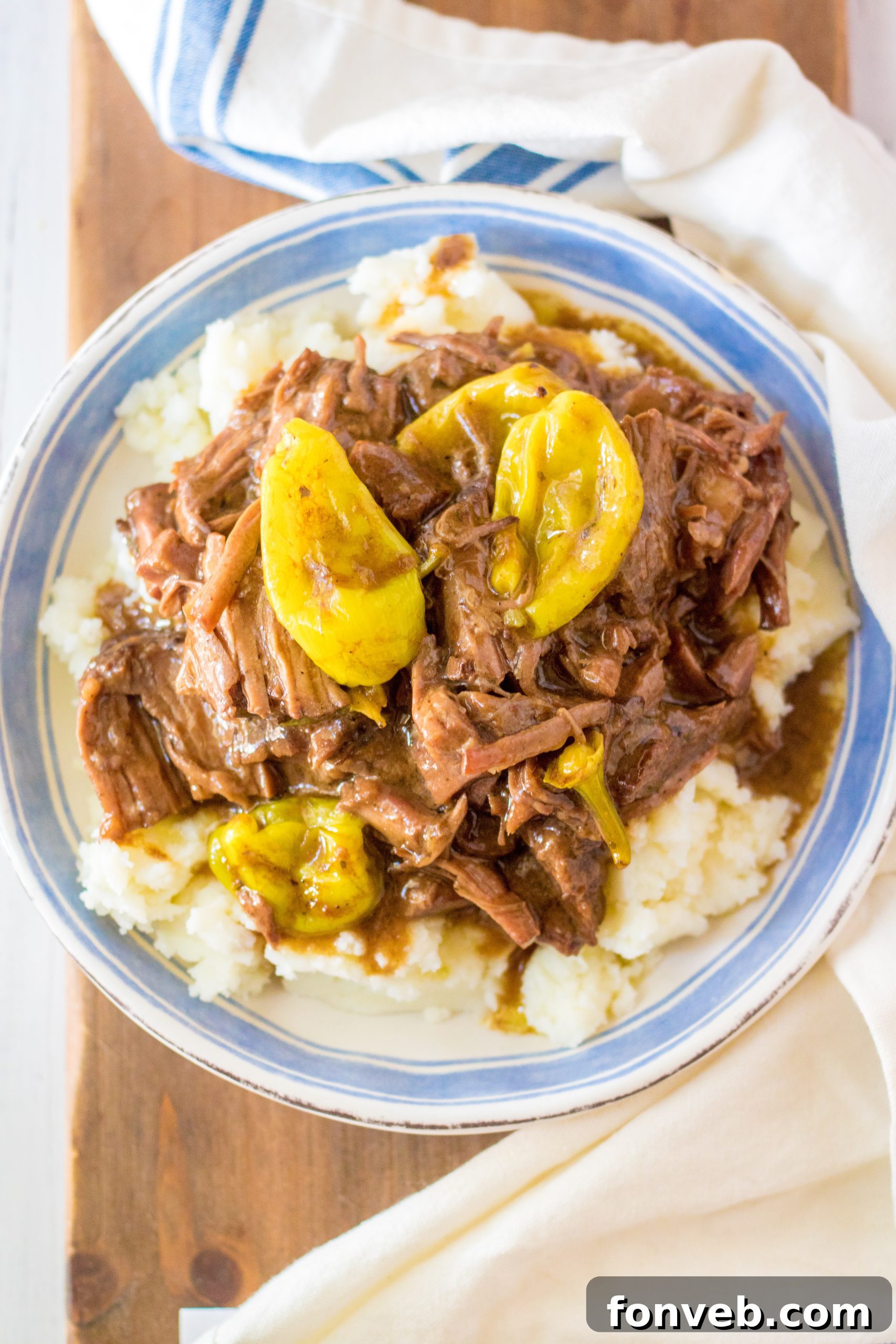 Melt-in-Your-Mouth Slow Cooker Mississippi Pot Roast 8 Cooked Mississippi Pot Roast being shredded with two forks.