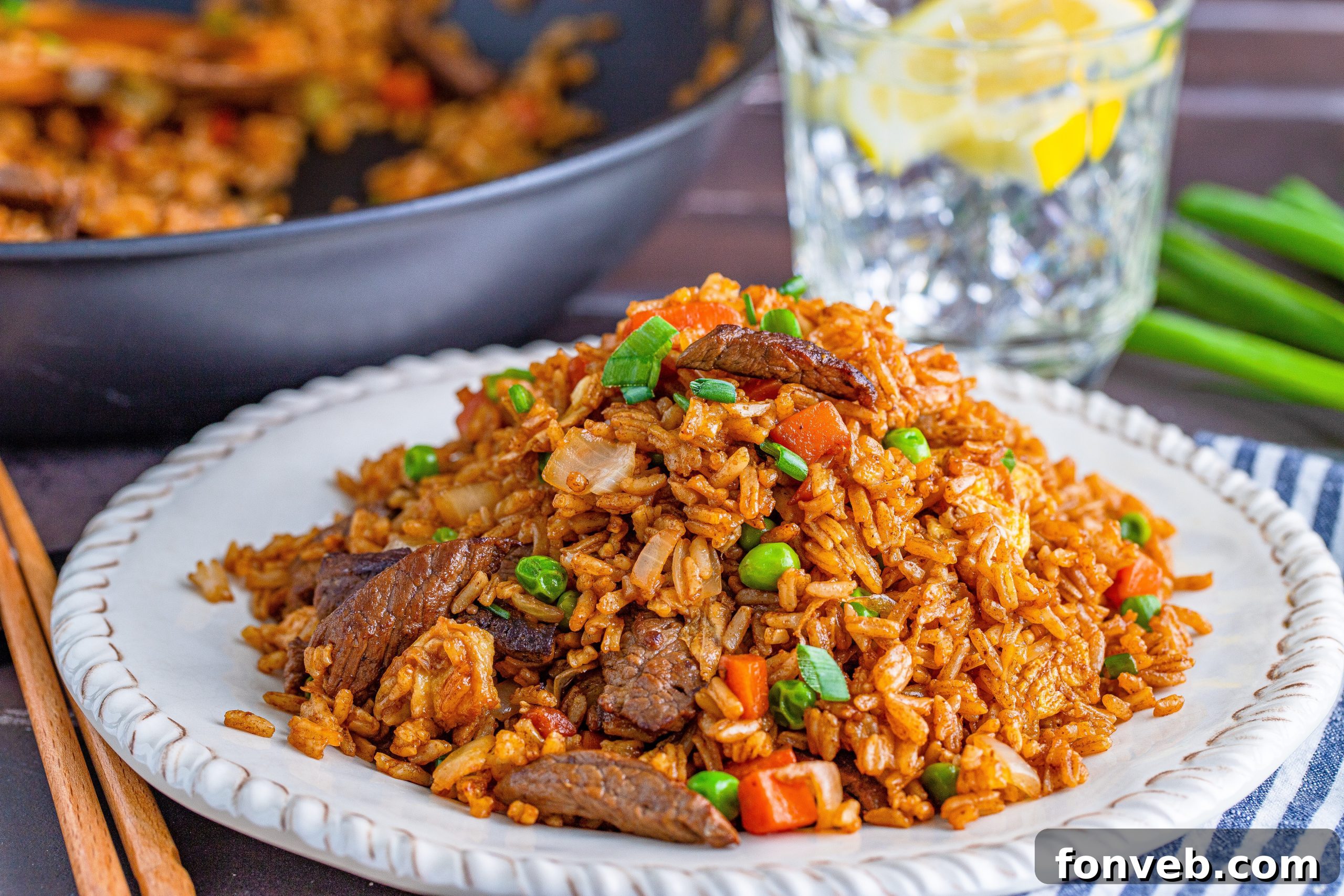A vibrant bowl of Beef Fried Rice, perfectly seasoned and ready for serving, showcasing its rich textures and colors.