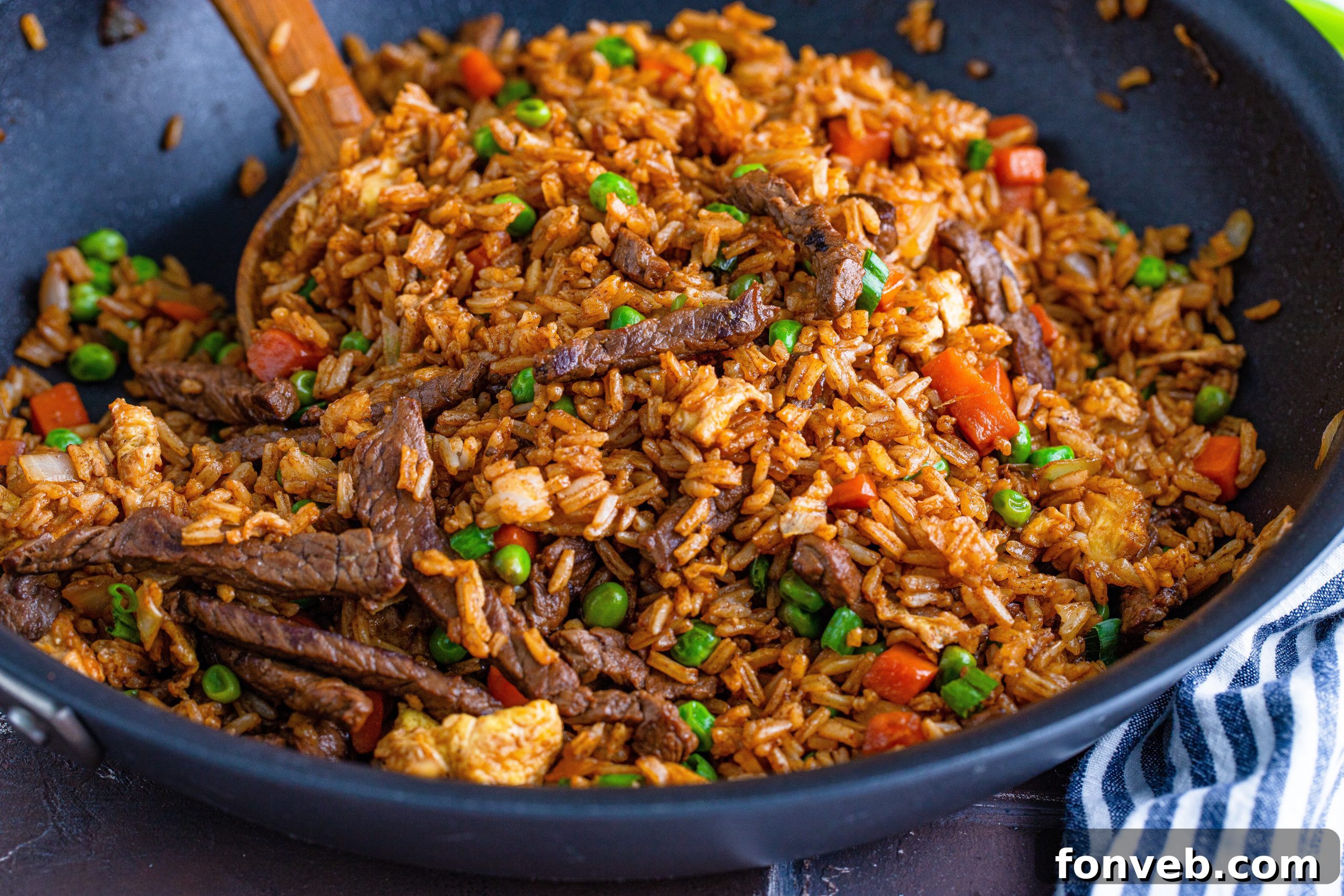 A generous portion of Beef Fried Rice in a bowl, perfect for a satisfying meal.