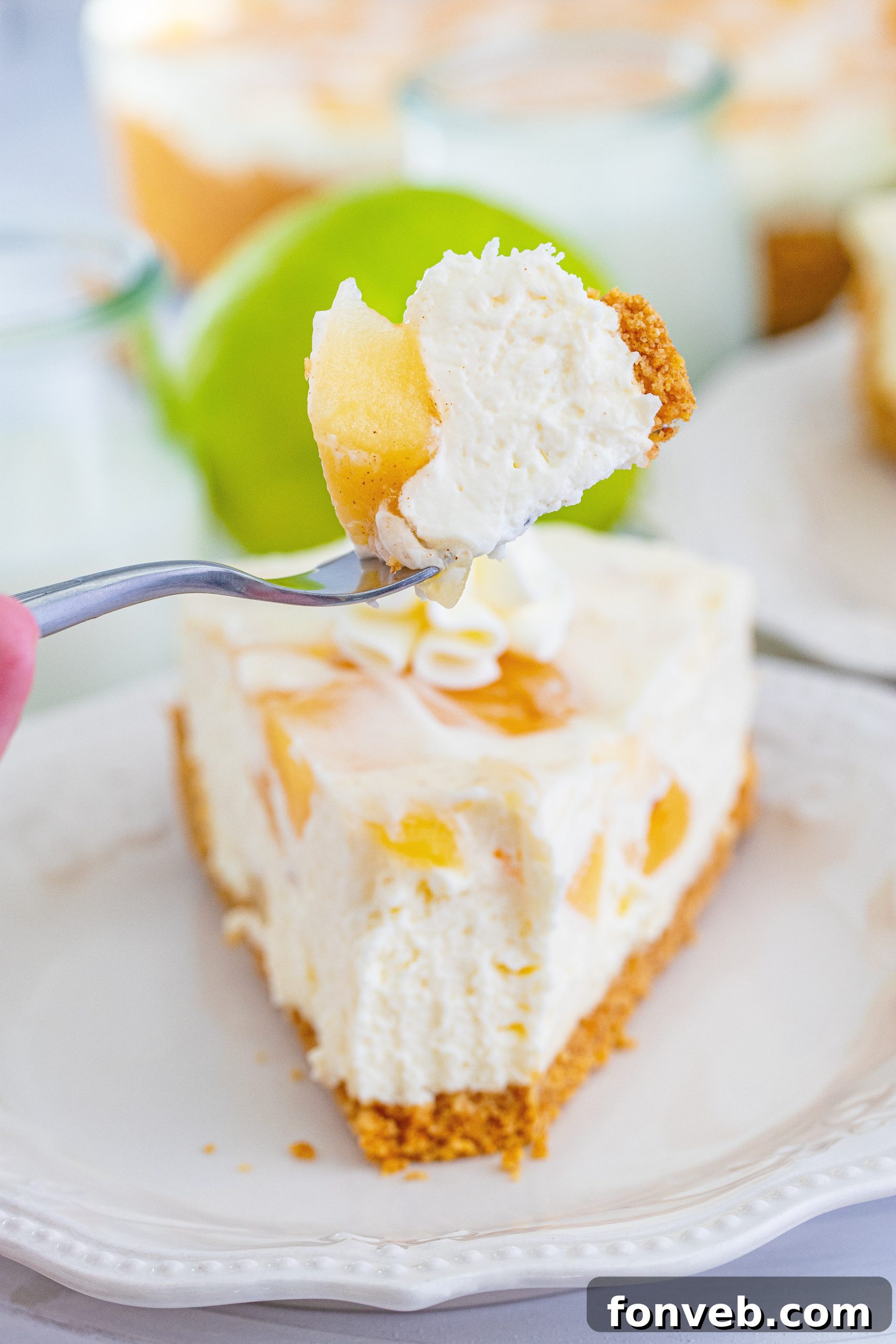 Chilled Apple Pie Cheesecake 11 Smooth cream cheese filling spread over the graham cracker crust in a springform pan.